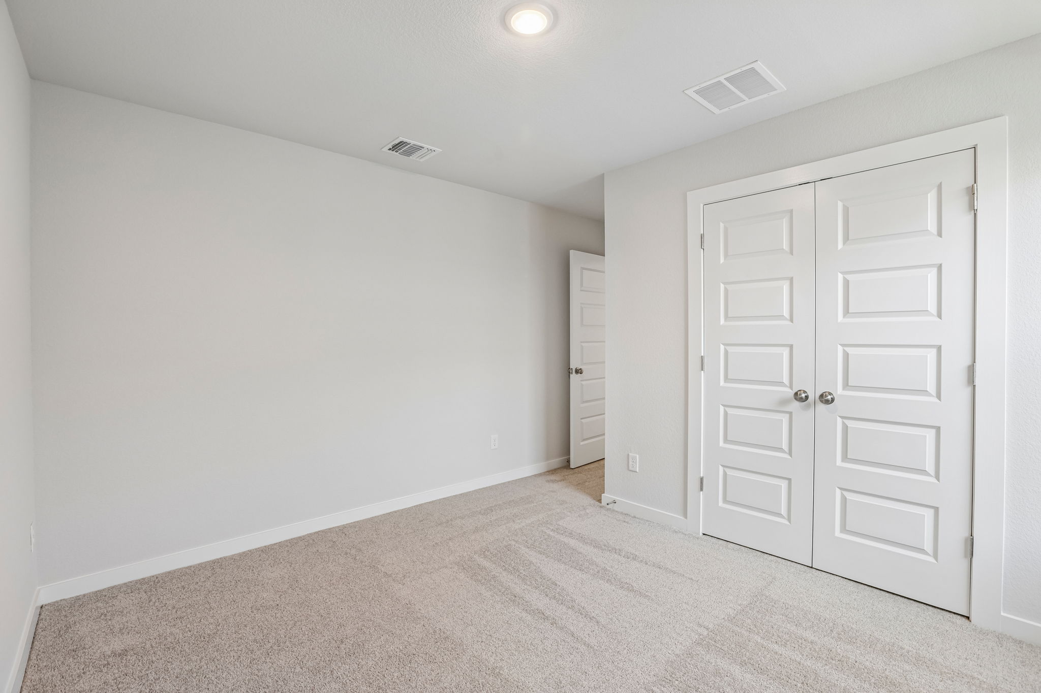 A room with white doors.