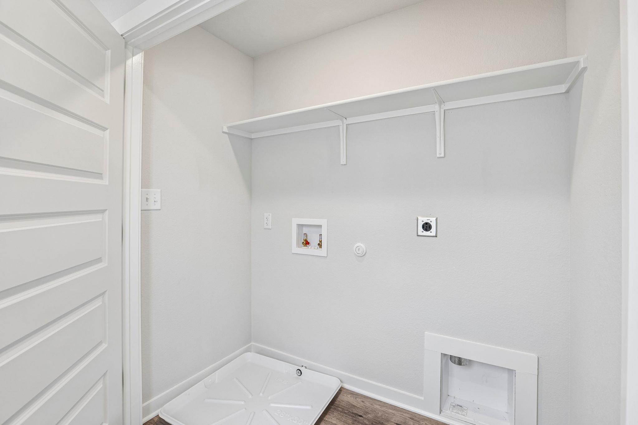 A white room with a white wall.