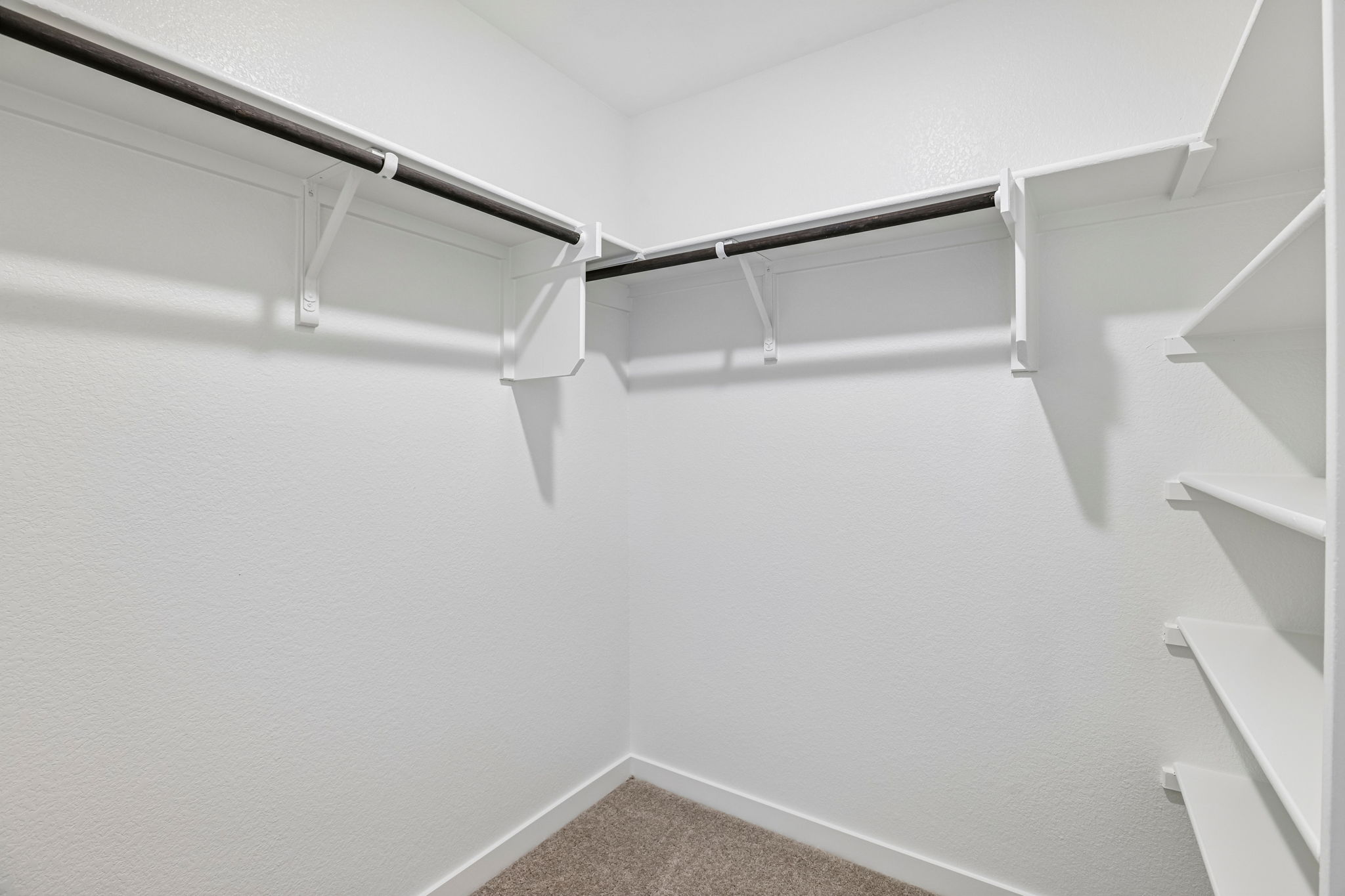 A white staircase with a railing.
