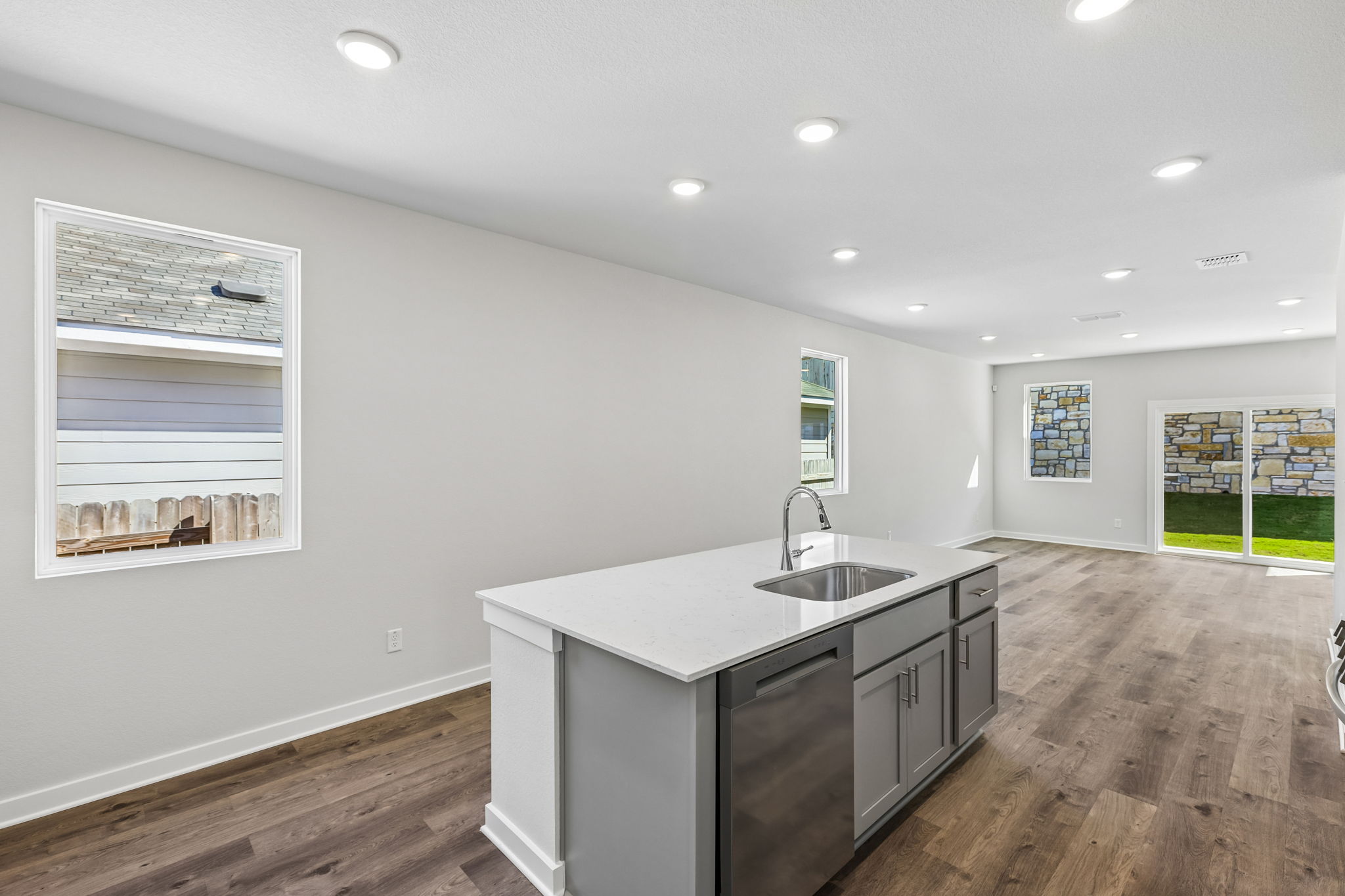 A kitchen with a sink and cabinets.