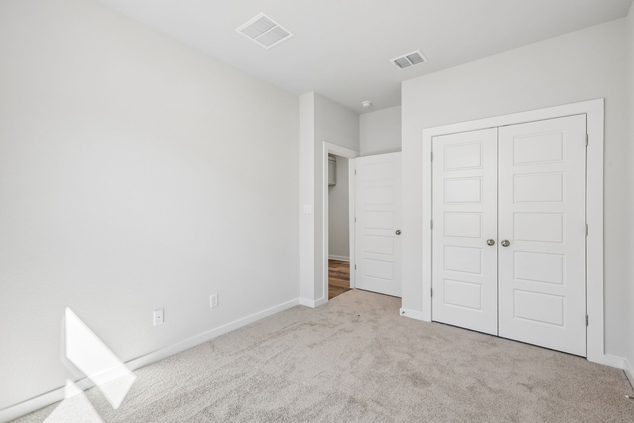A room with white doors.