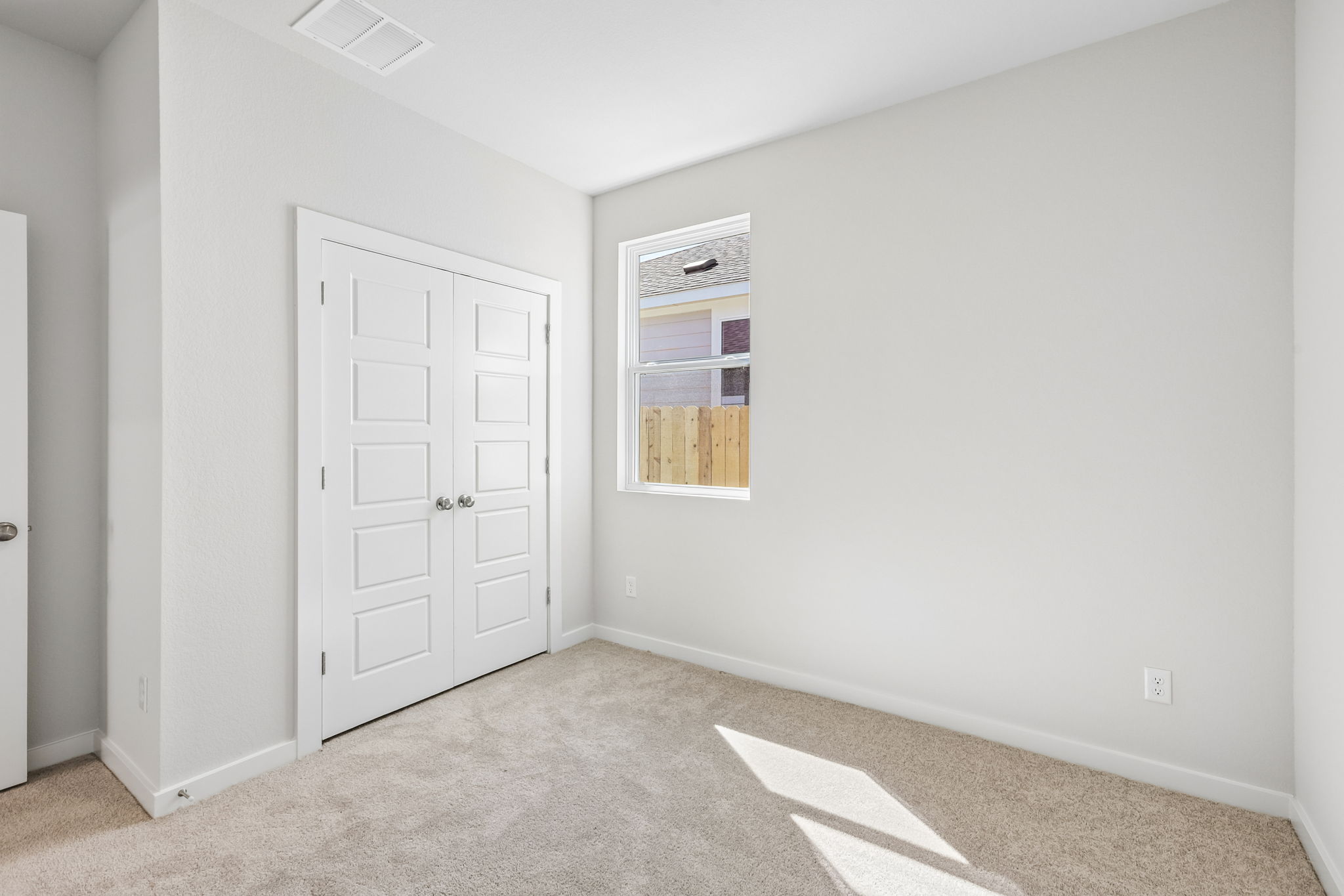 A room with white doors.