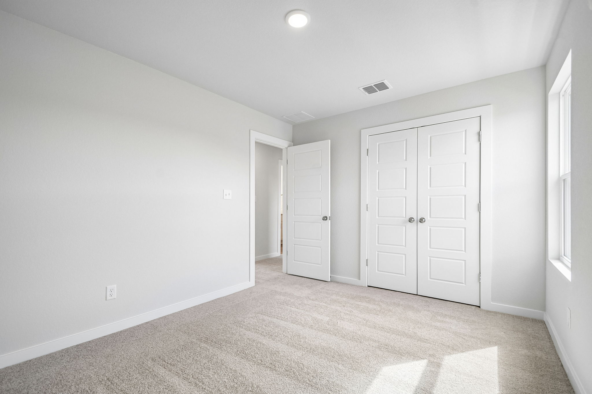 A room with white doors.