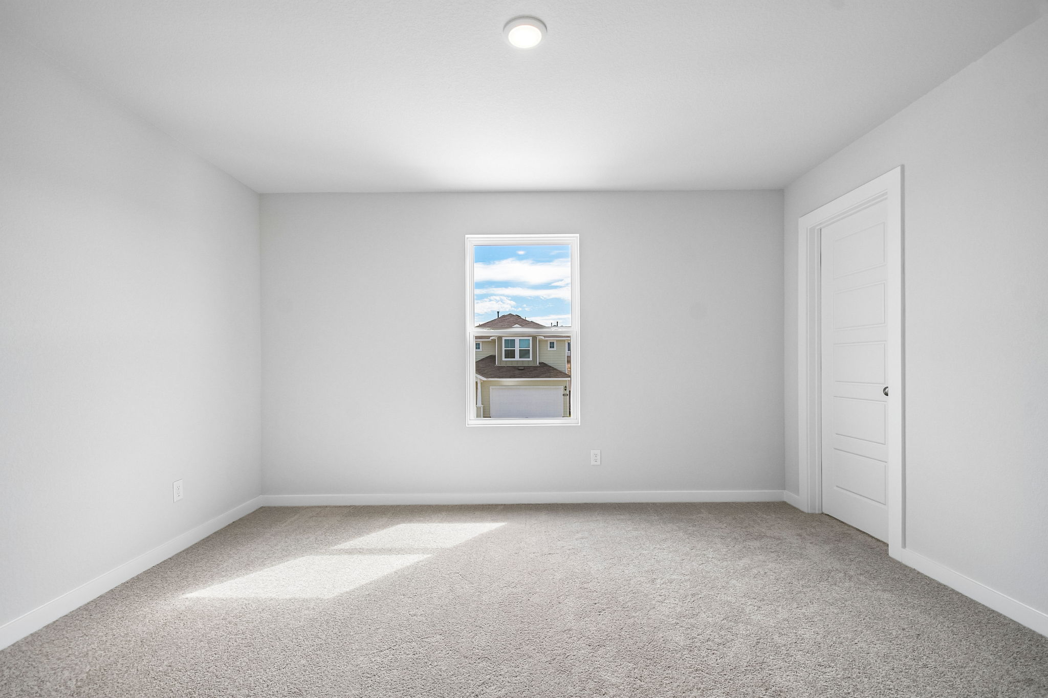A room with a painting on the wall.