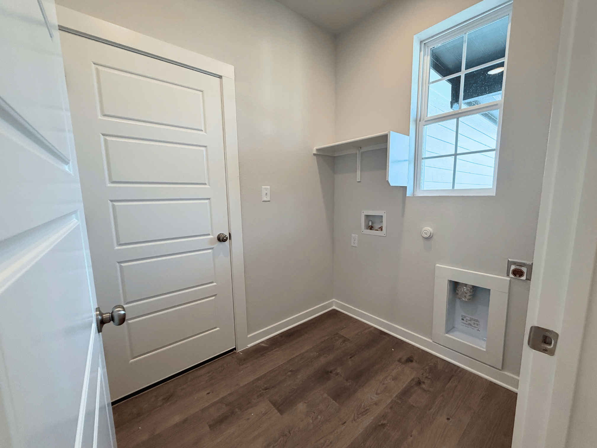 A room with white cabinets.