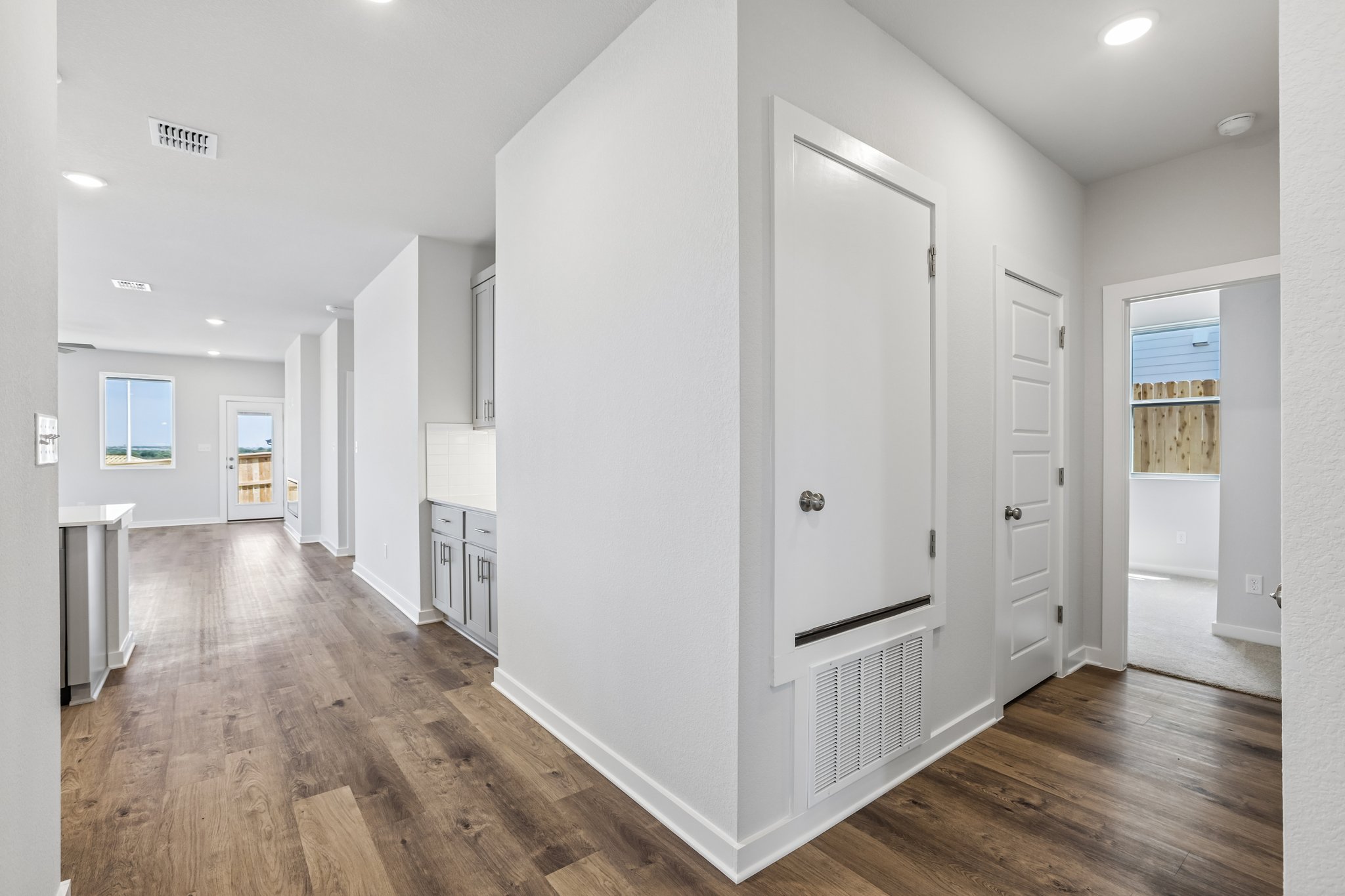 A room with white cabinets.
