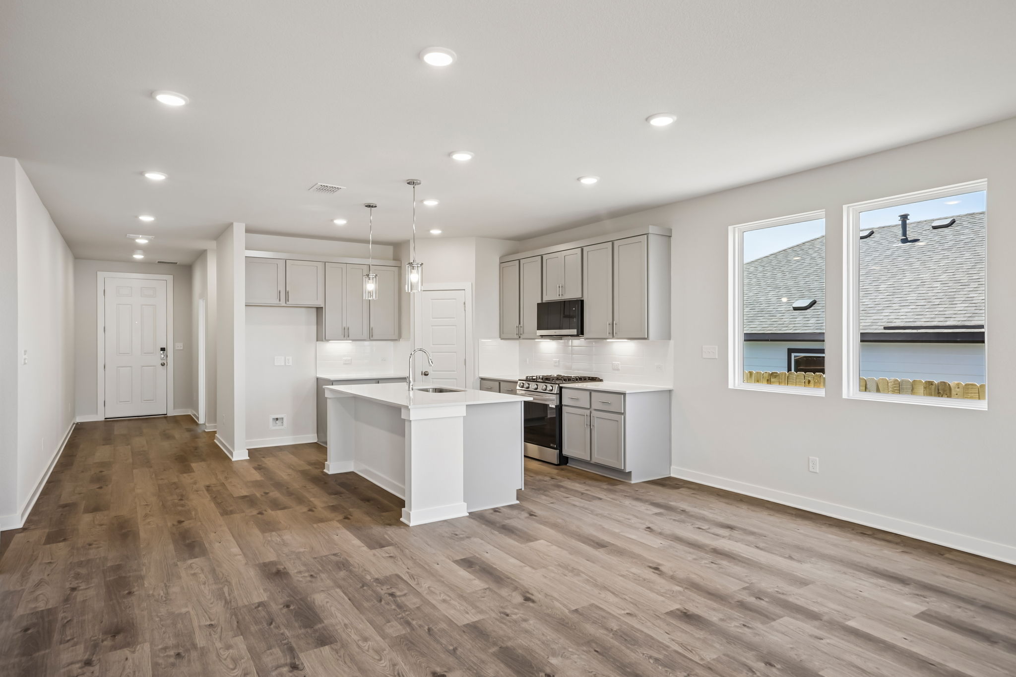 A large kitchen with white cabinets.