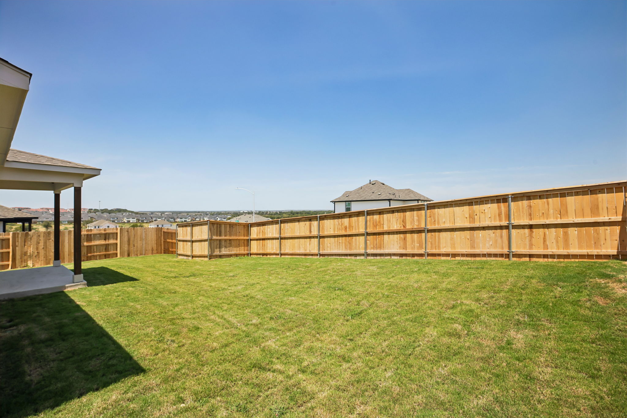 A fenced in grass field.