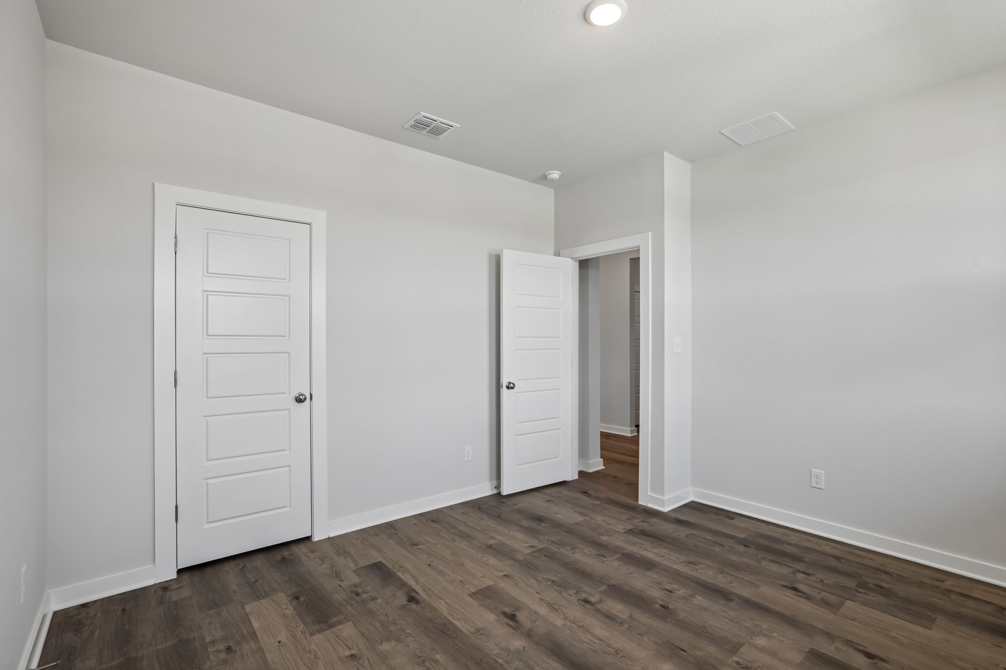 A room with white doors.