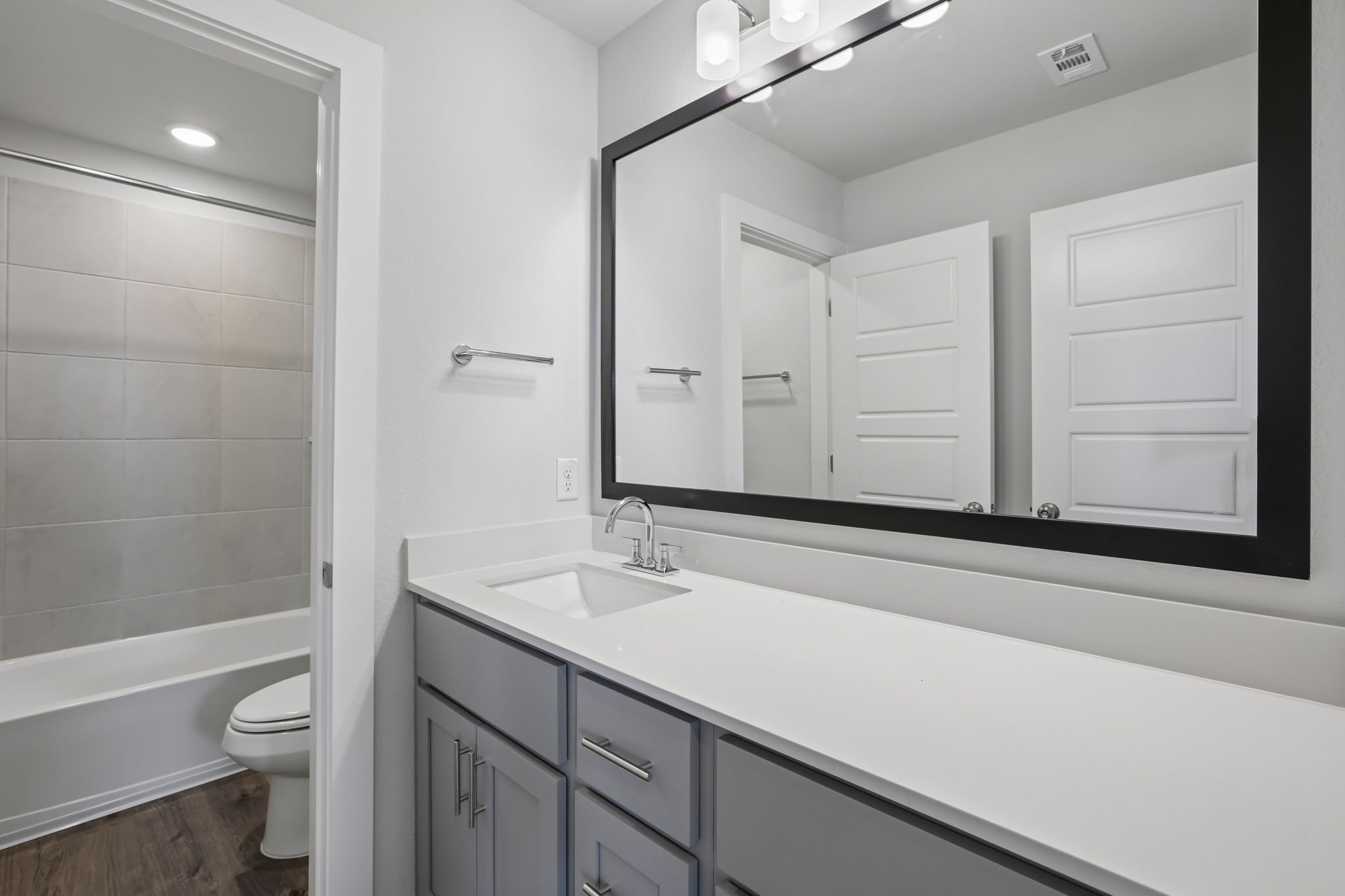 A bathroom with a sink and a toilet.