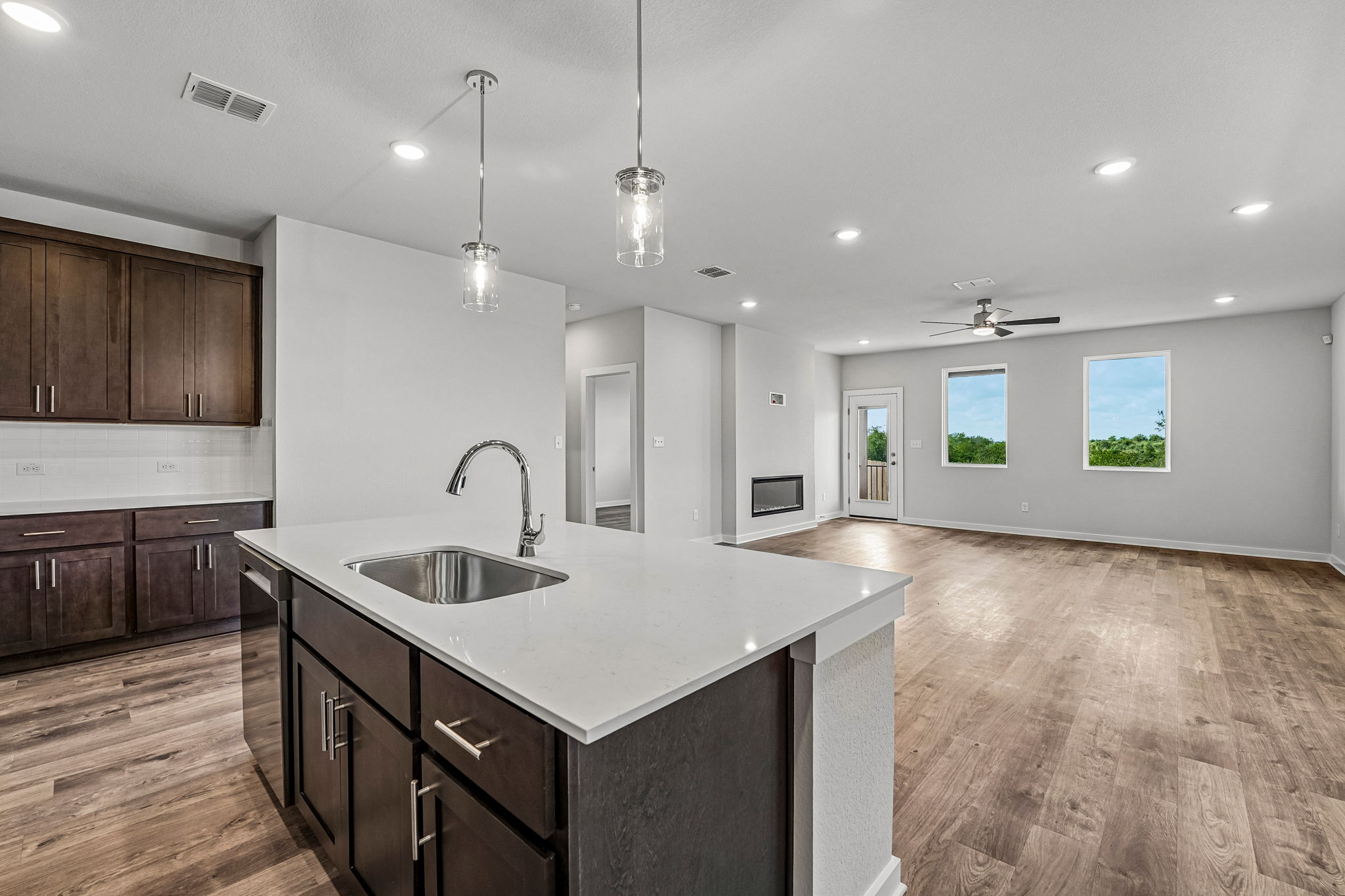 A kitchen with a marble island.