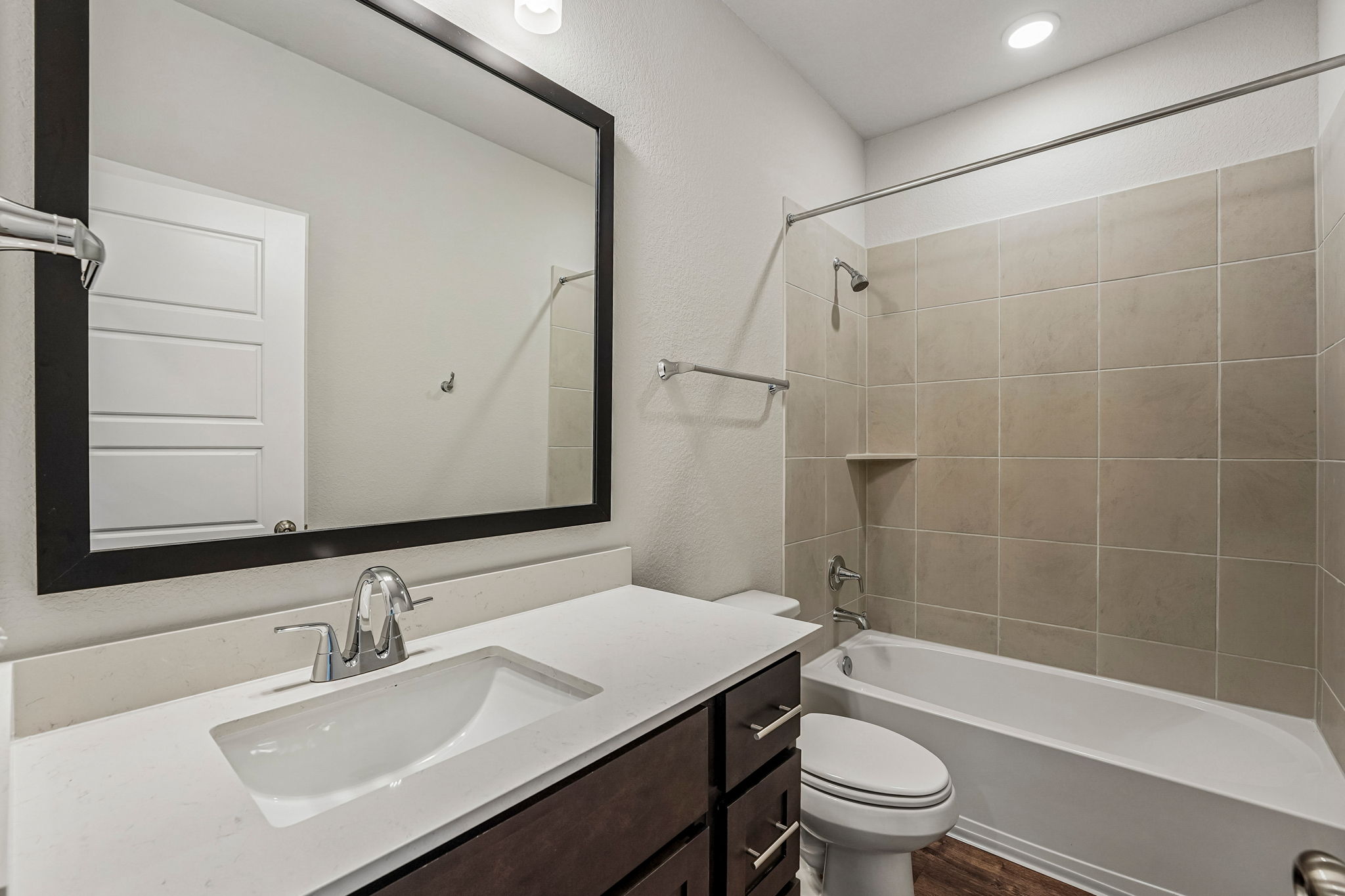 A bathroom with a sink and a toilet.