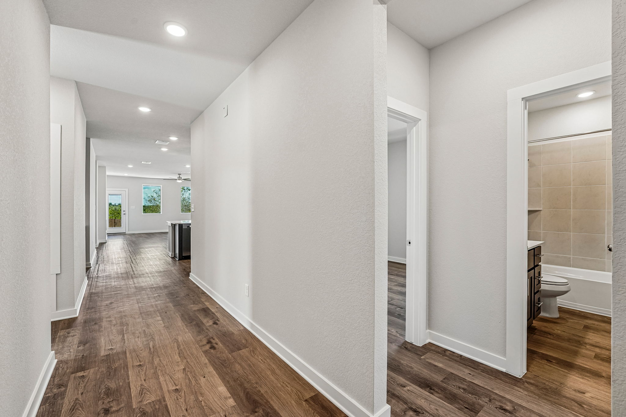 A bathroom with a wood floor.
