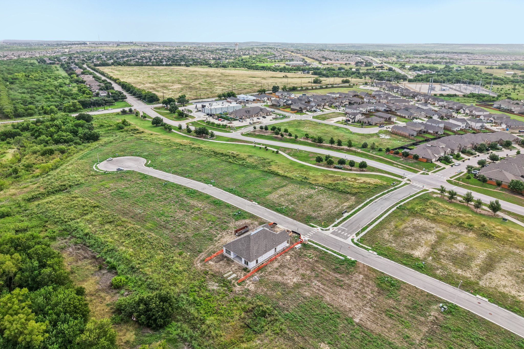 A large area with a road and buildings in it.