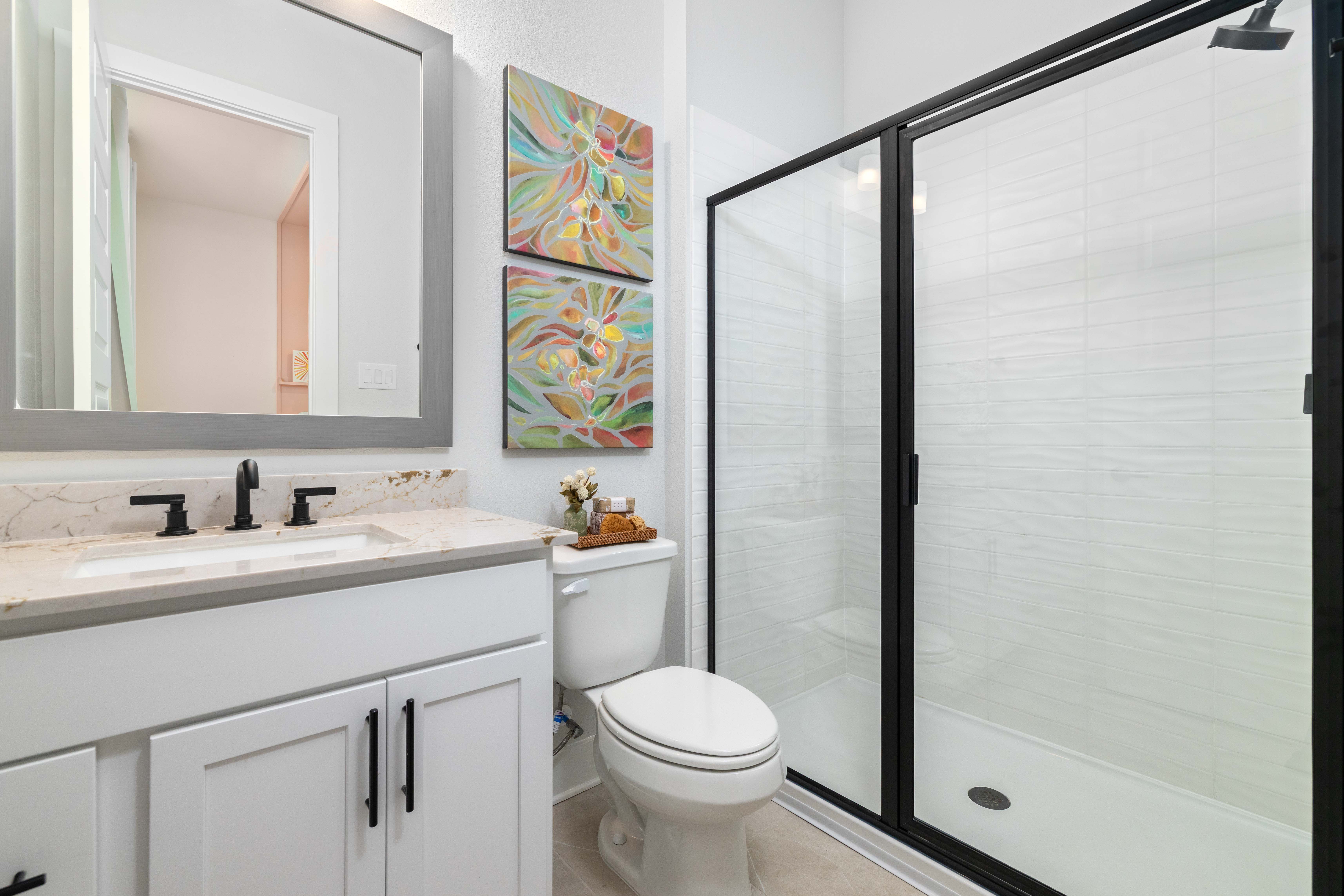 A bathroom with a glass shower.