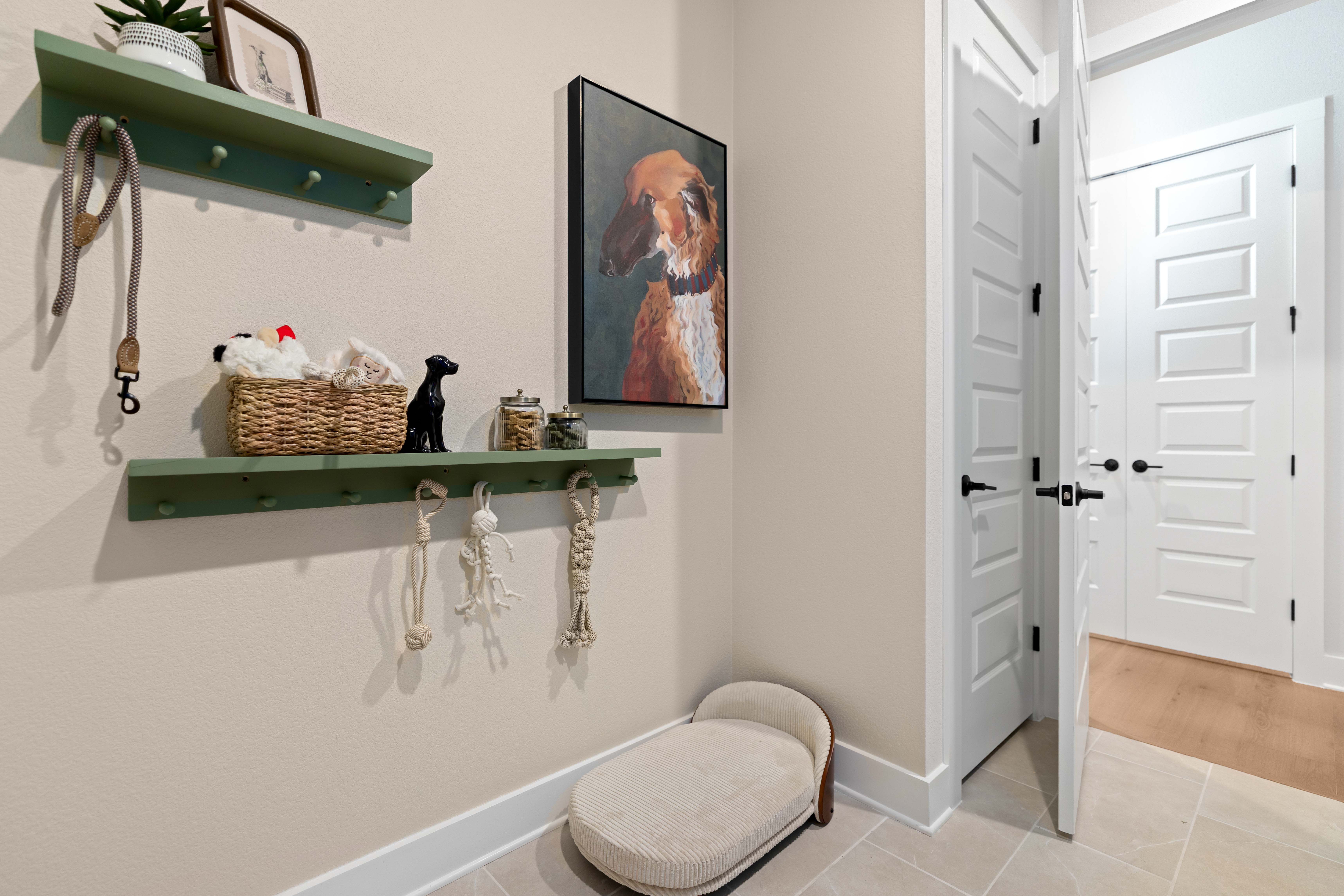 A room with a shelf and a chair.