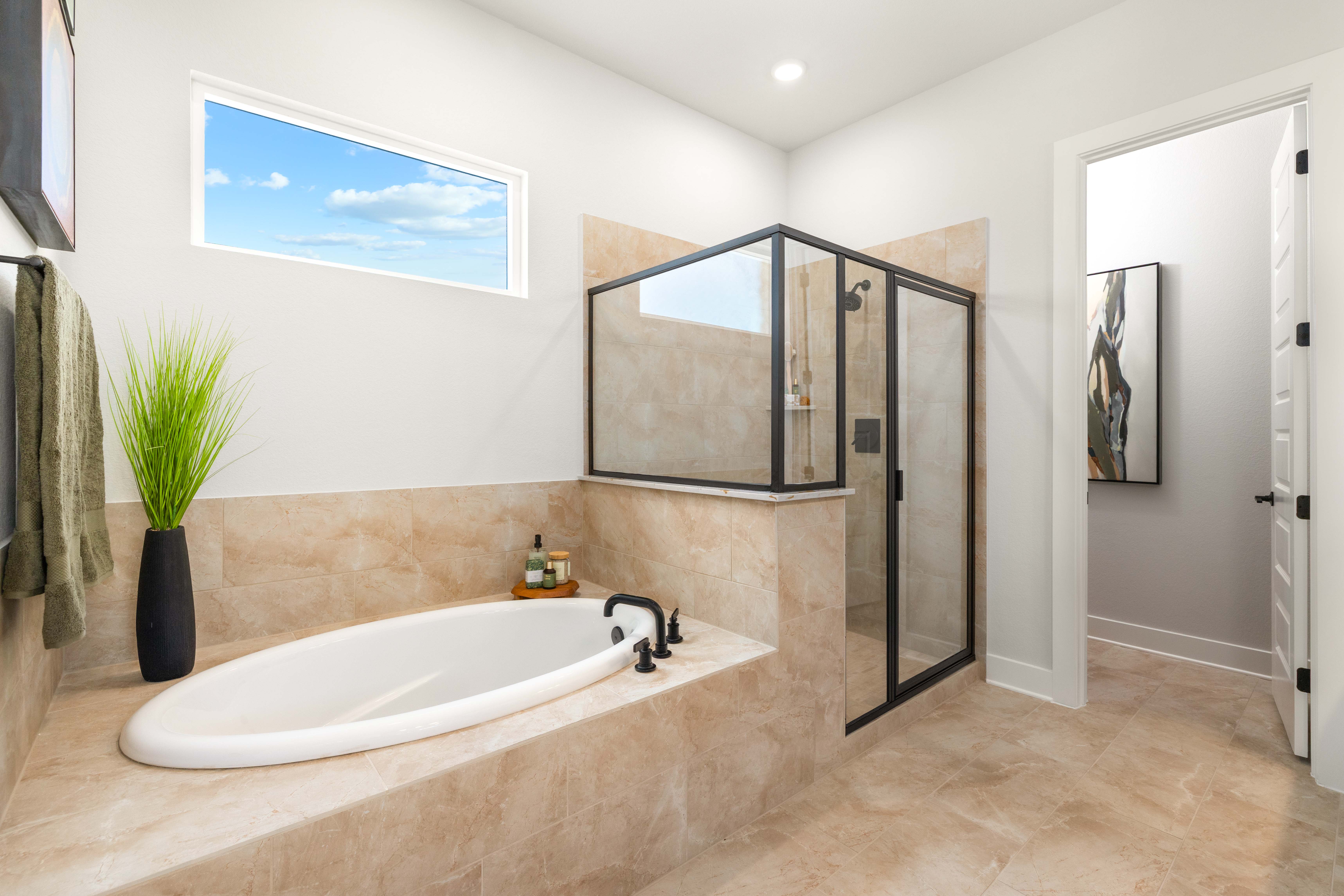 A bathroom with a large tub.