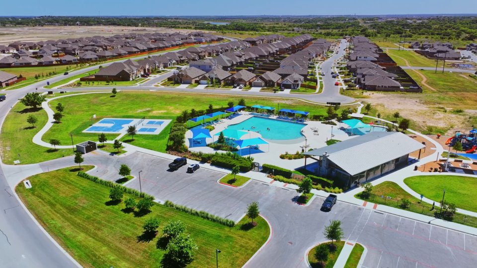 A large building with a pool.