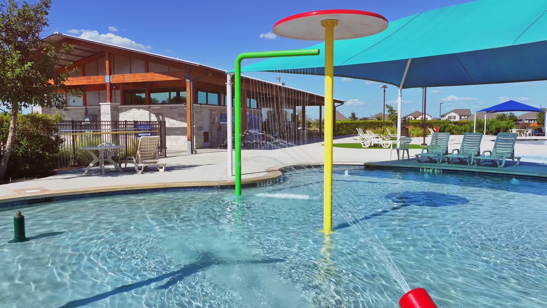 A pool with chairs and umbrellas.