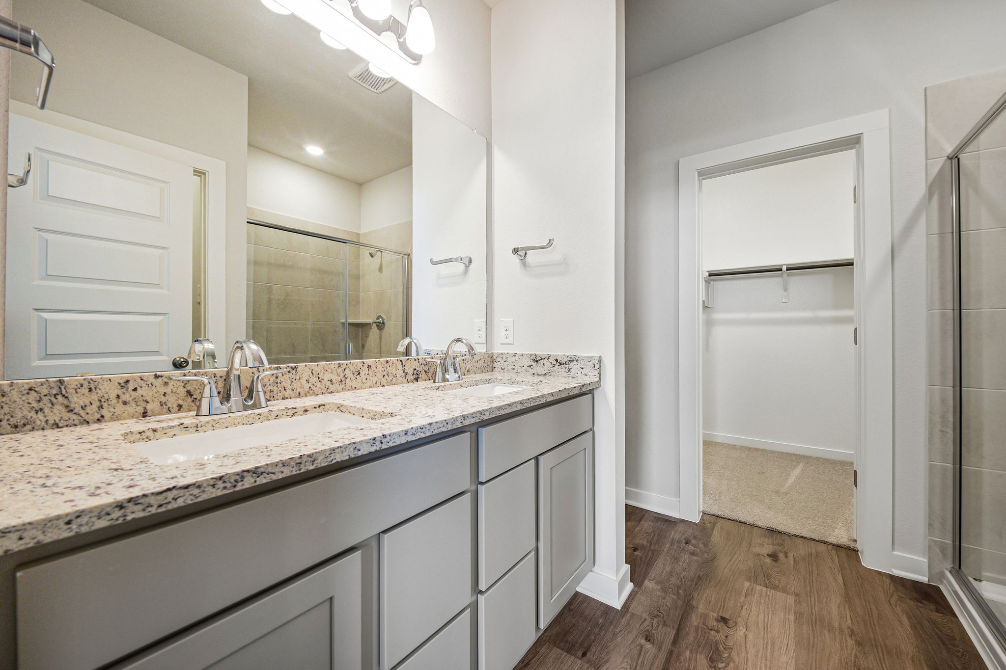 A bathroom with a marble countertop.