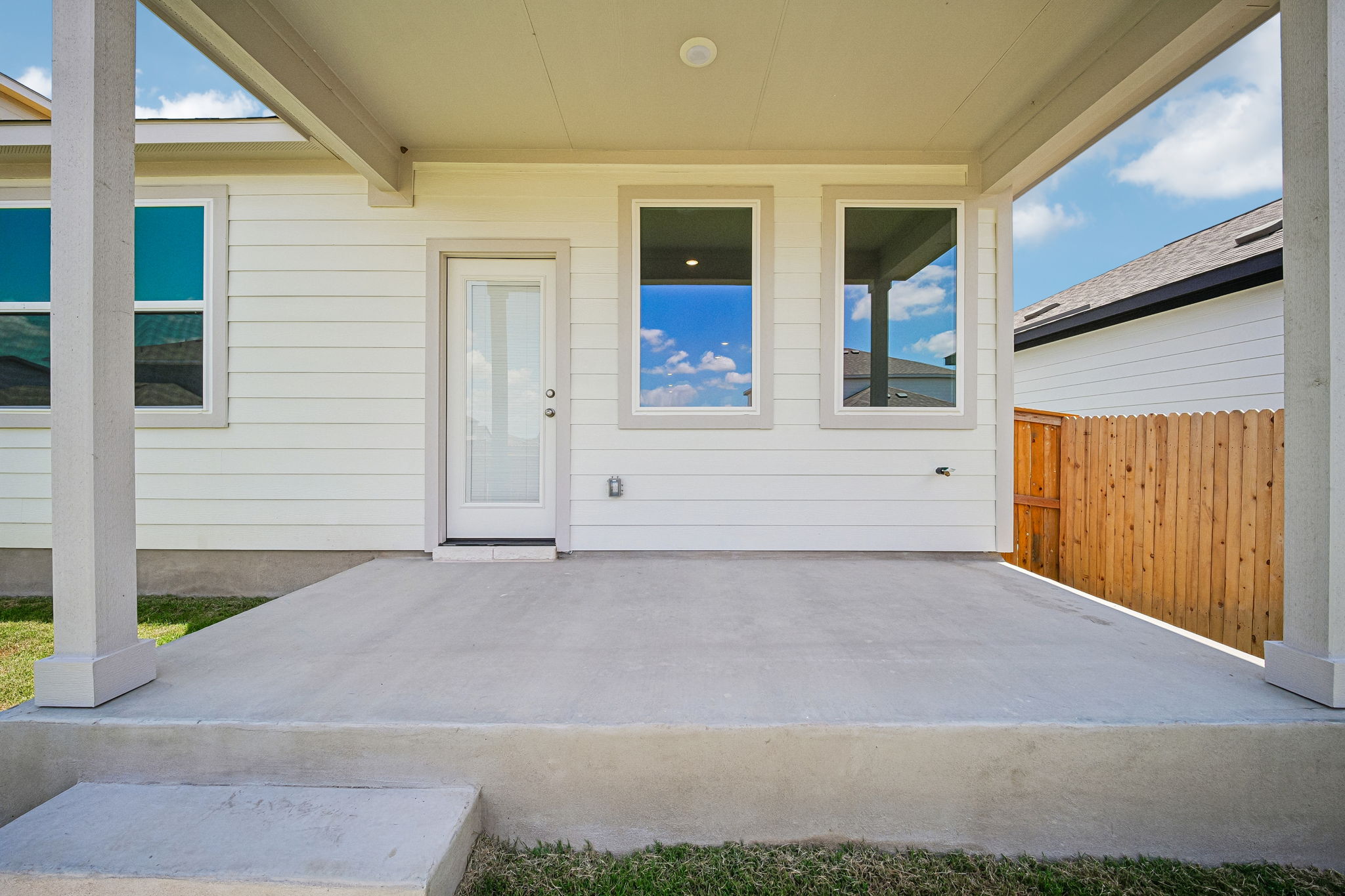A house with a garage and a porch.