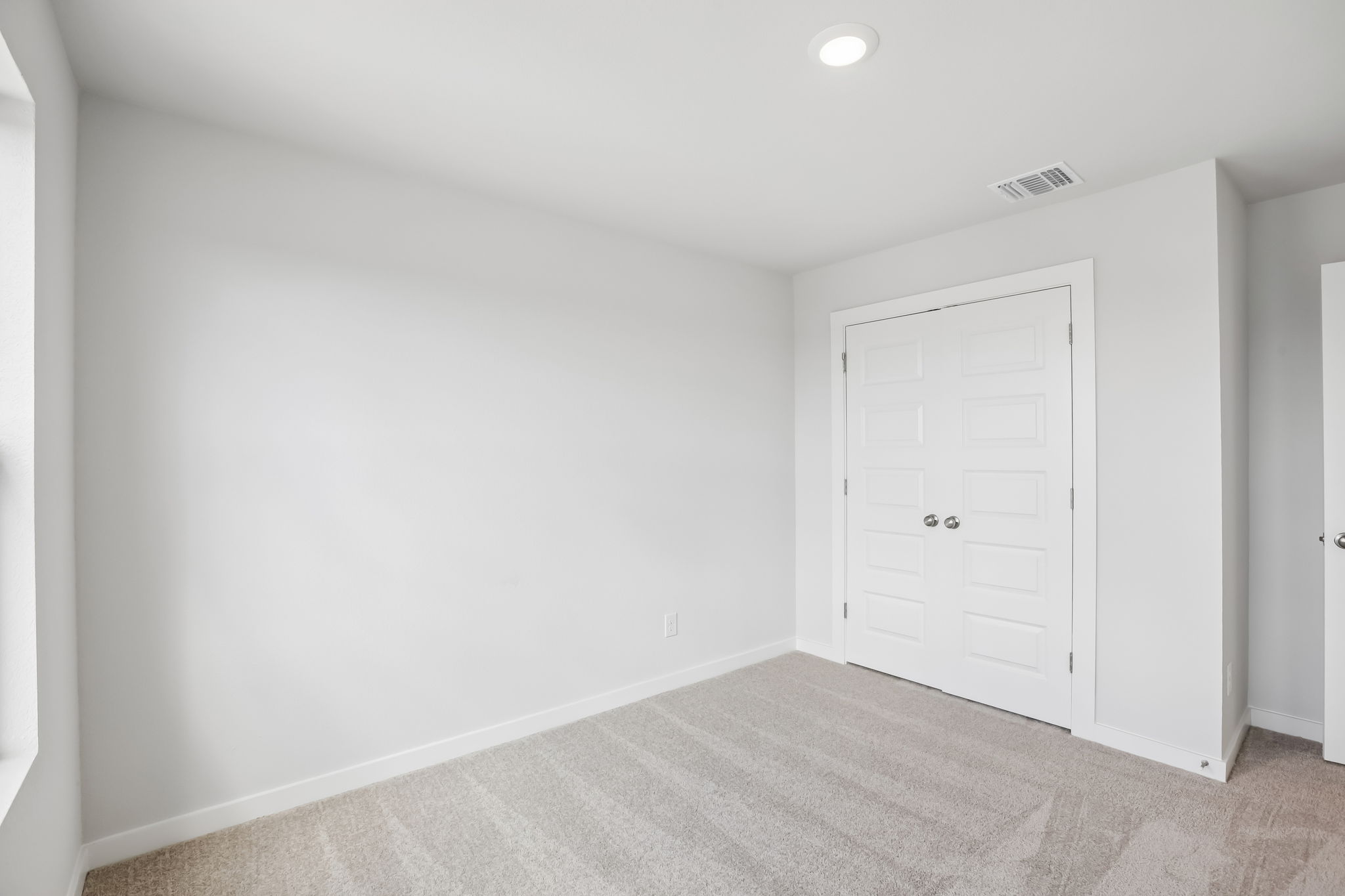 A room with white doors.