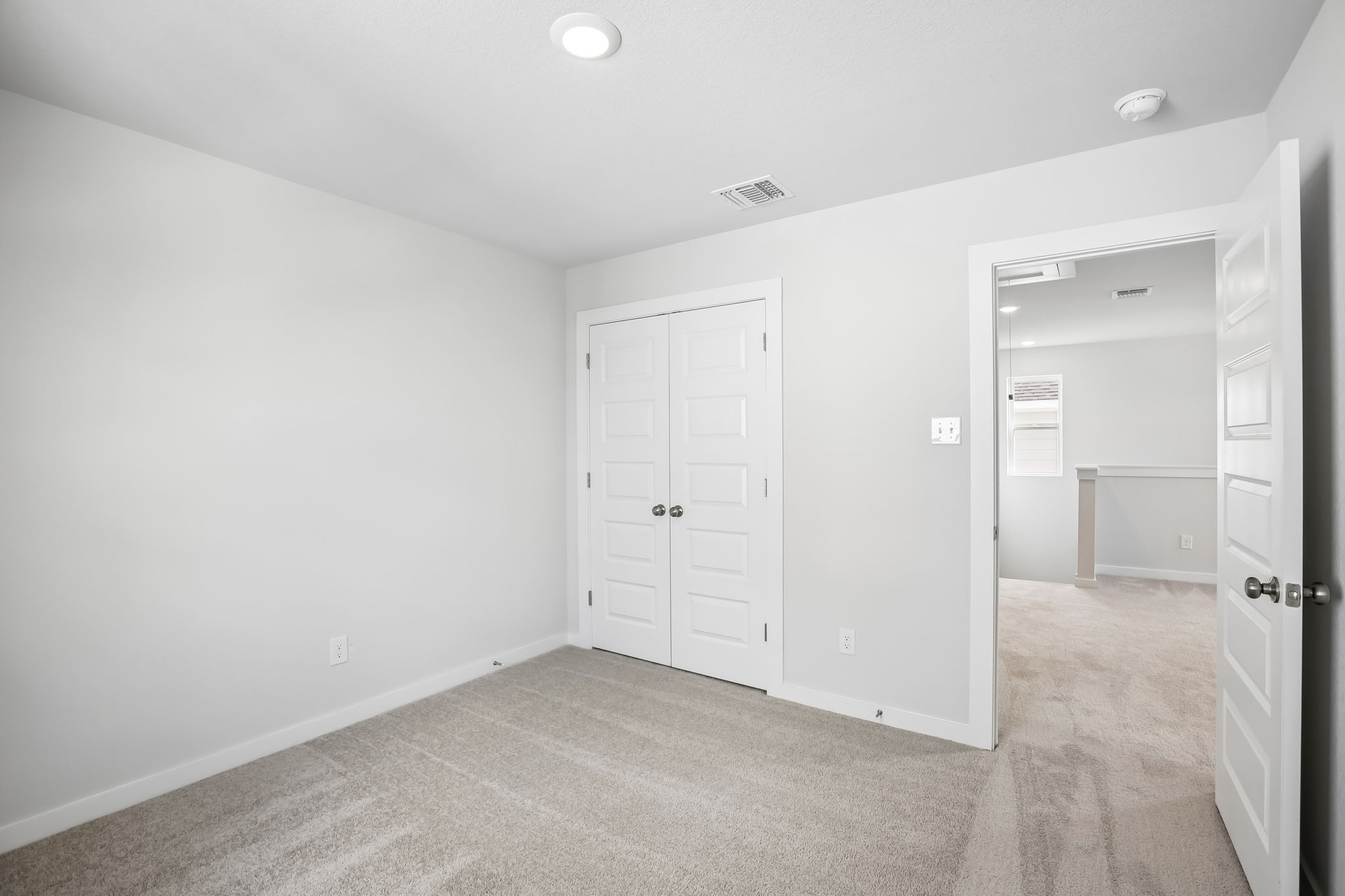 A room with white doors.