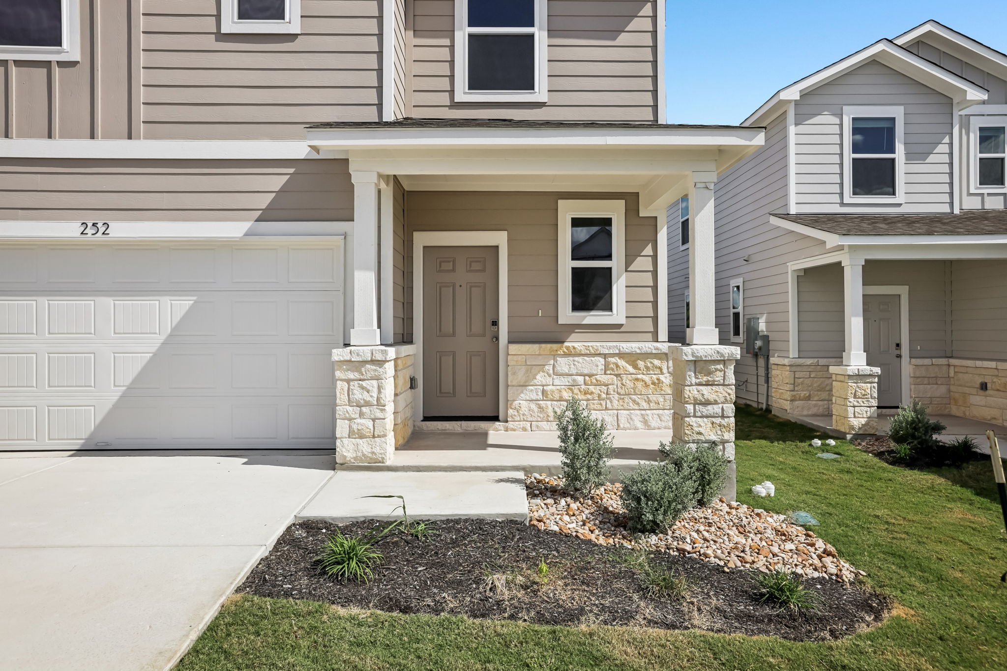 A house with a front yard.