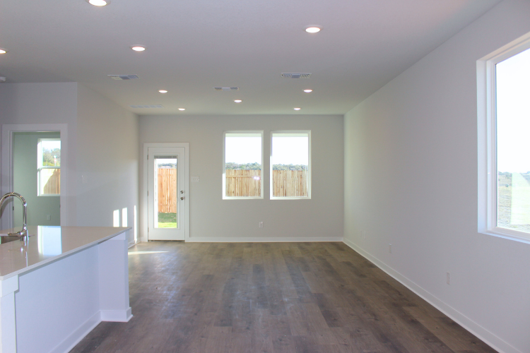 A bathroom with a wood floor.