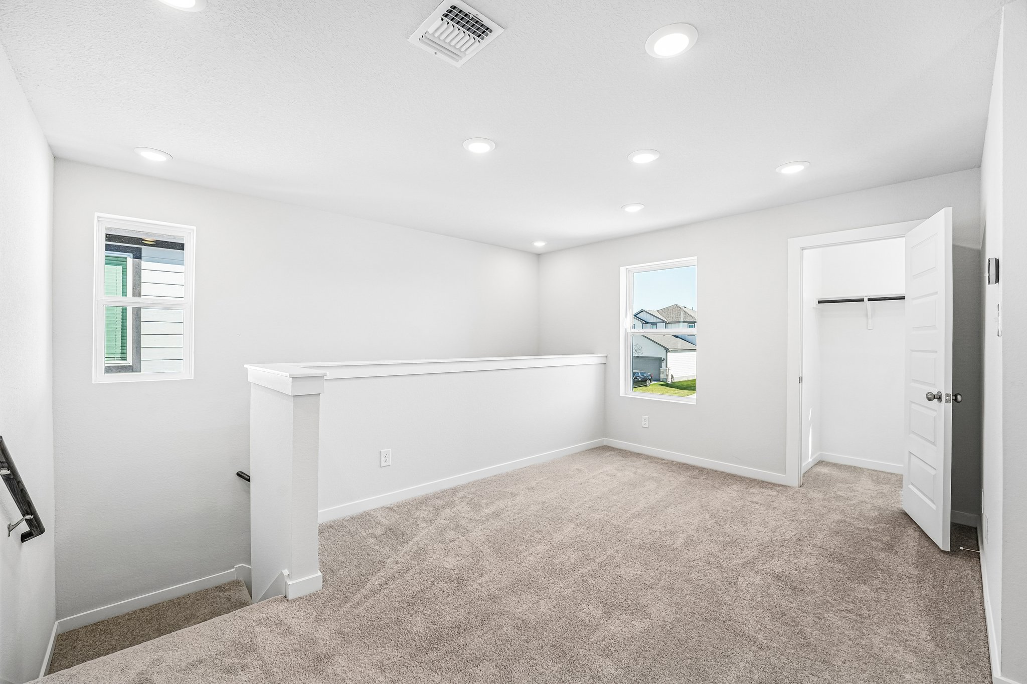 A room with white cabinets.