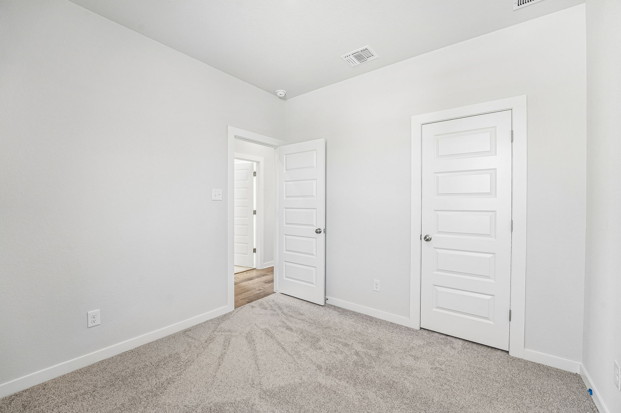 A room with white doors.