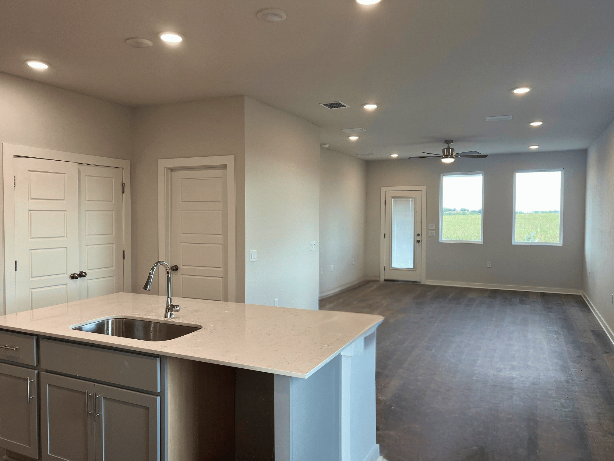 A kitchen with a marble countertop.