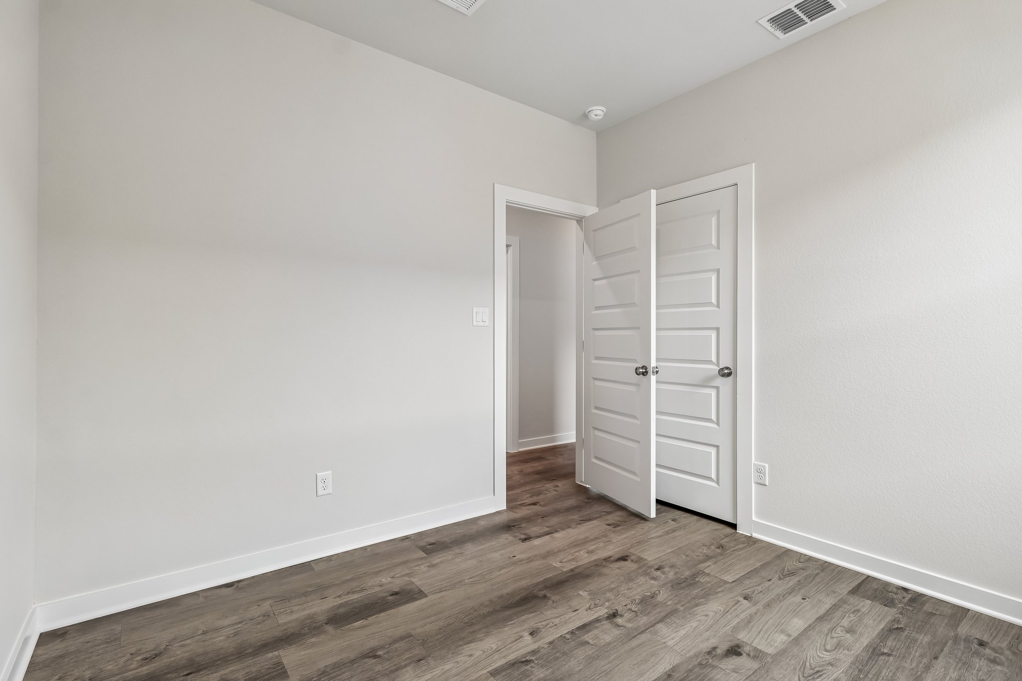 A room with white cabinets.