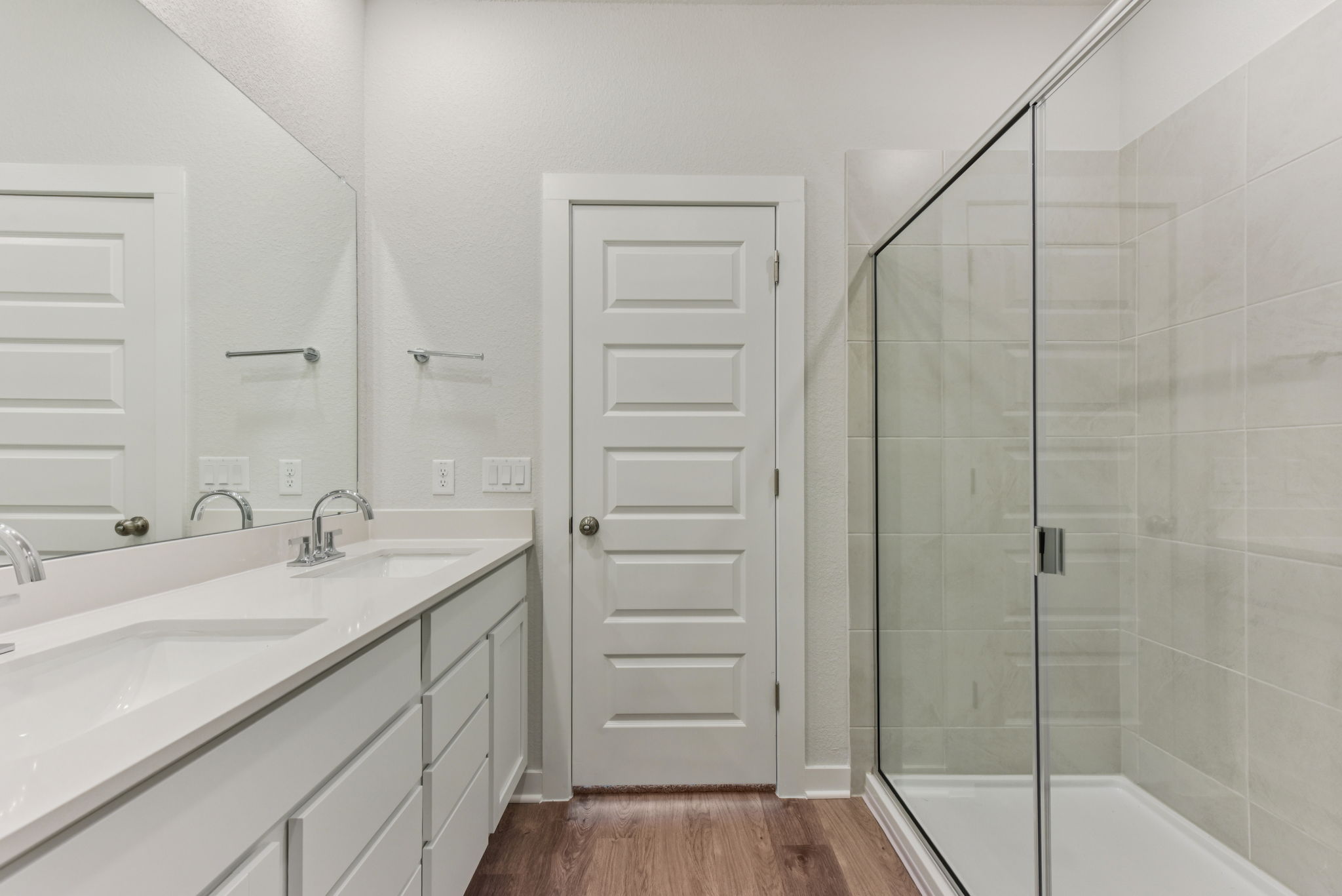 A bathroom with a glass shower.