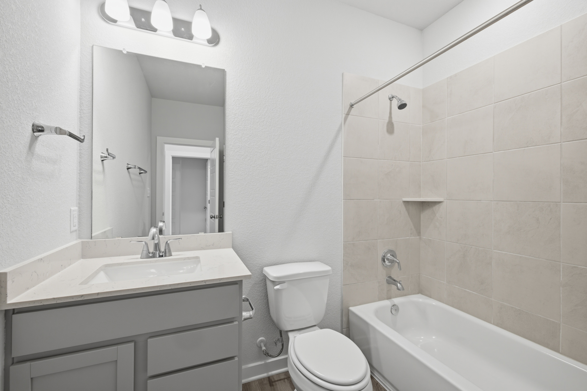 A bathroom with a toilet and sink.