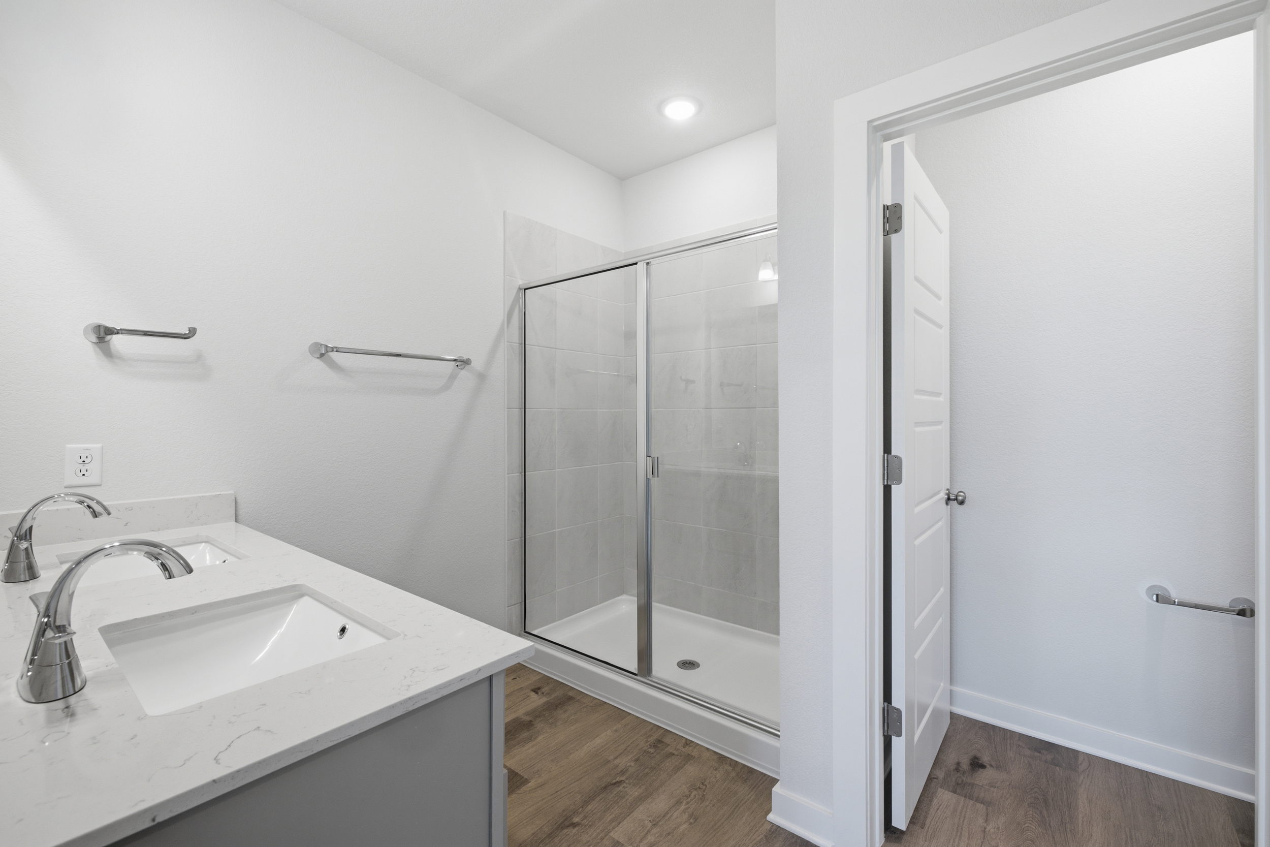 A bathroom with a glass shower.