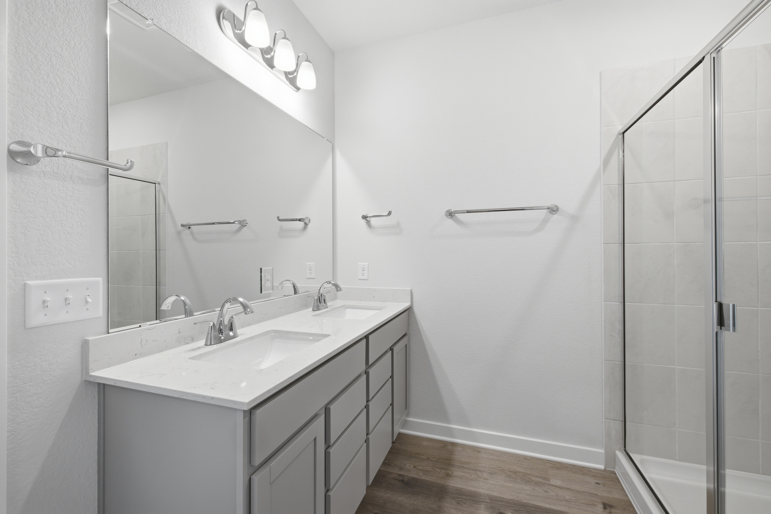 A bathroom with a glass shower.