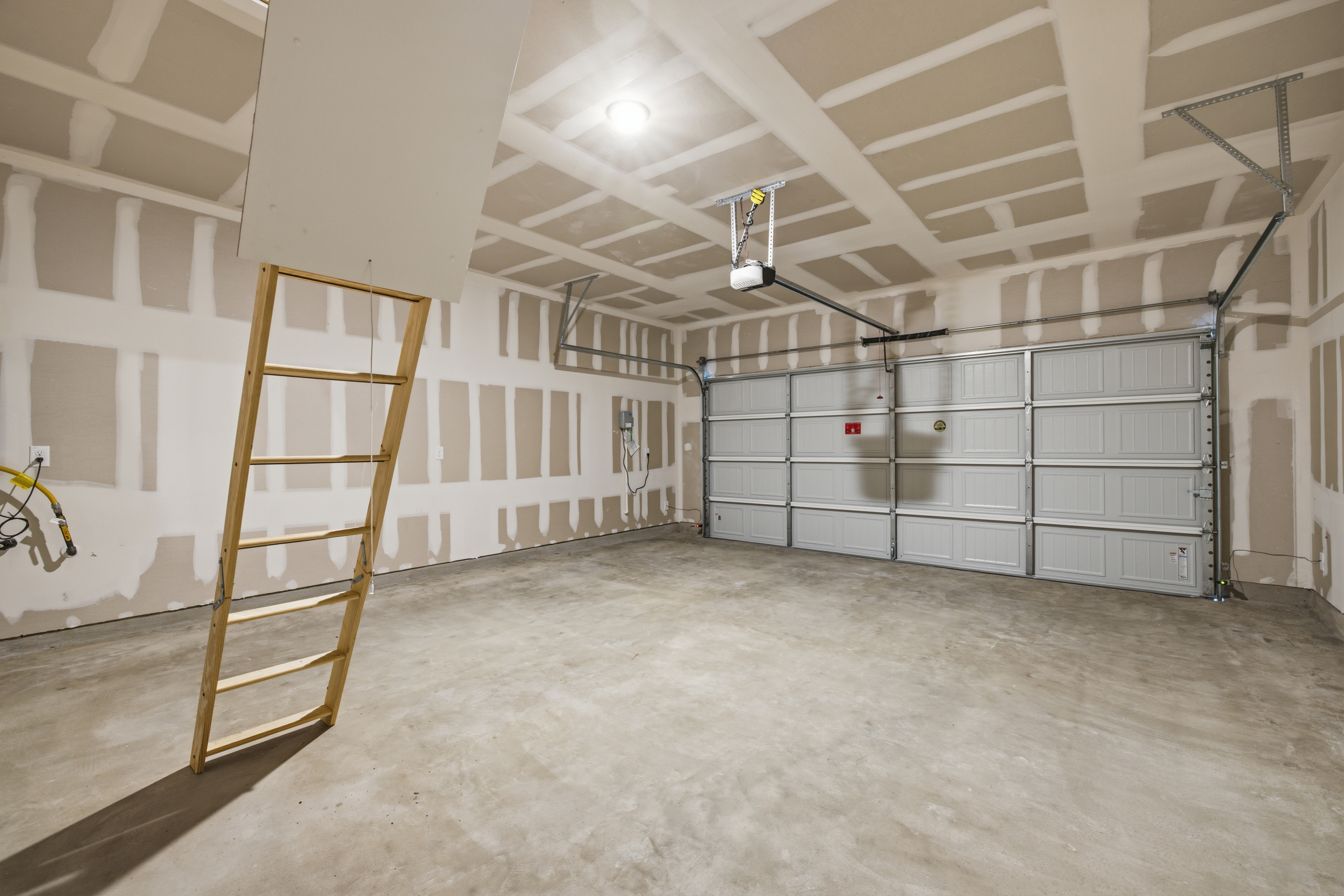 A room with a ladder and a ladder.
