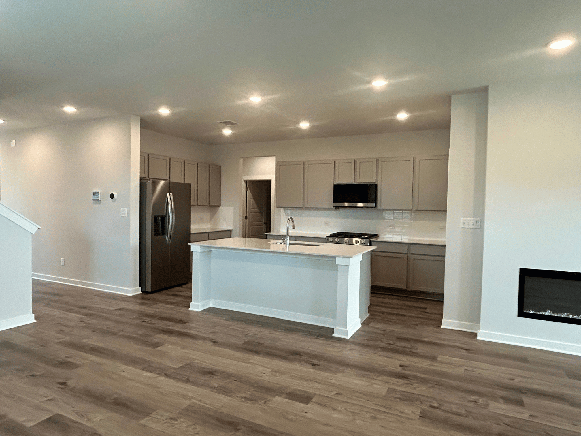 A kitchen with wooden floors.