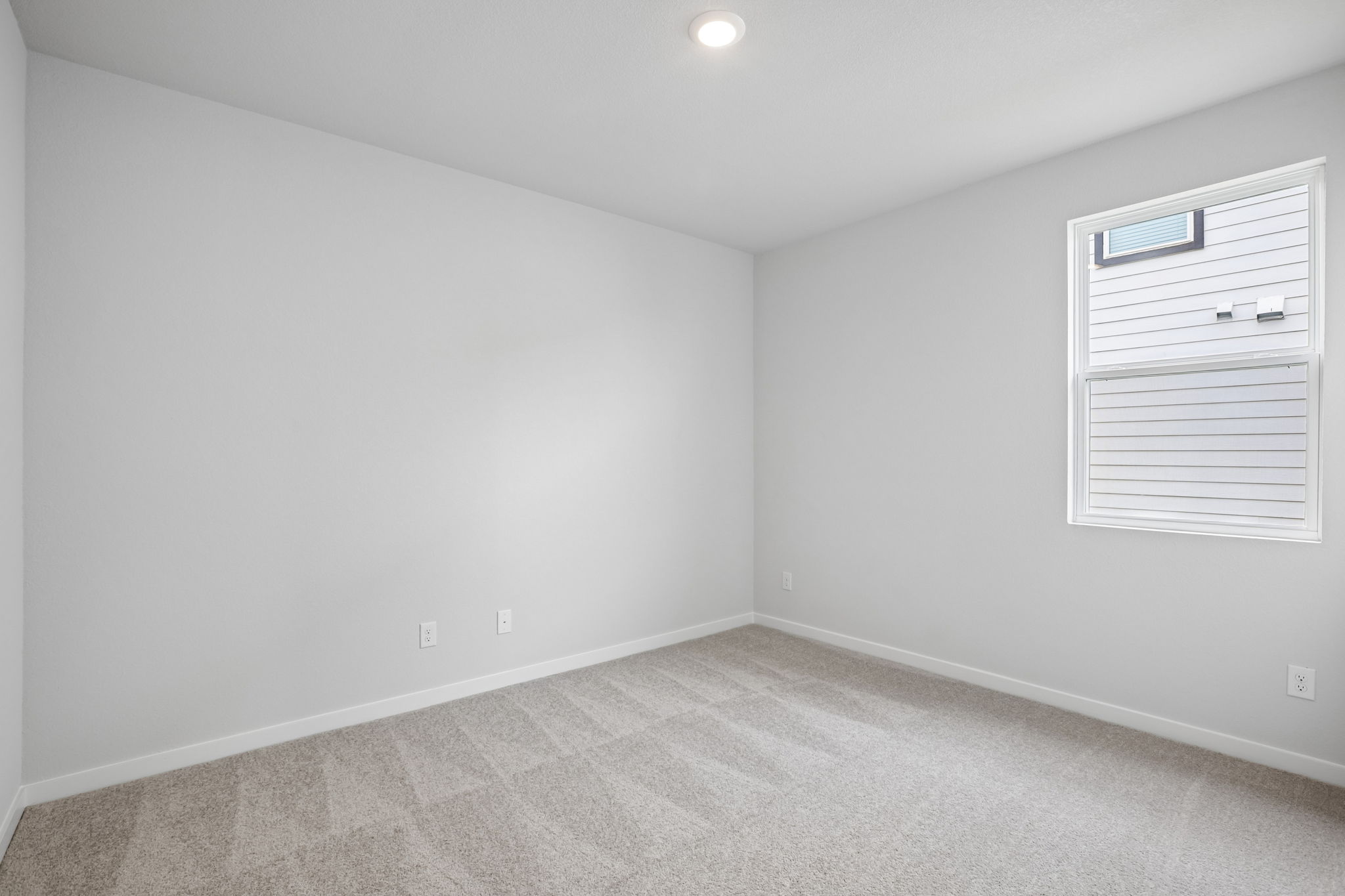 A room with a white wall and a white floor.