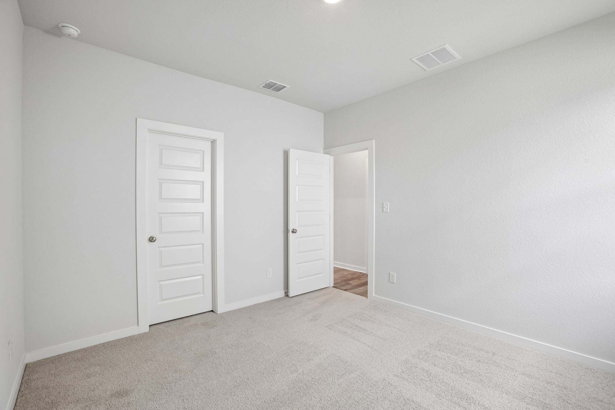 A room with white doors.