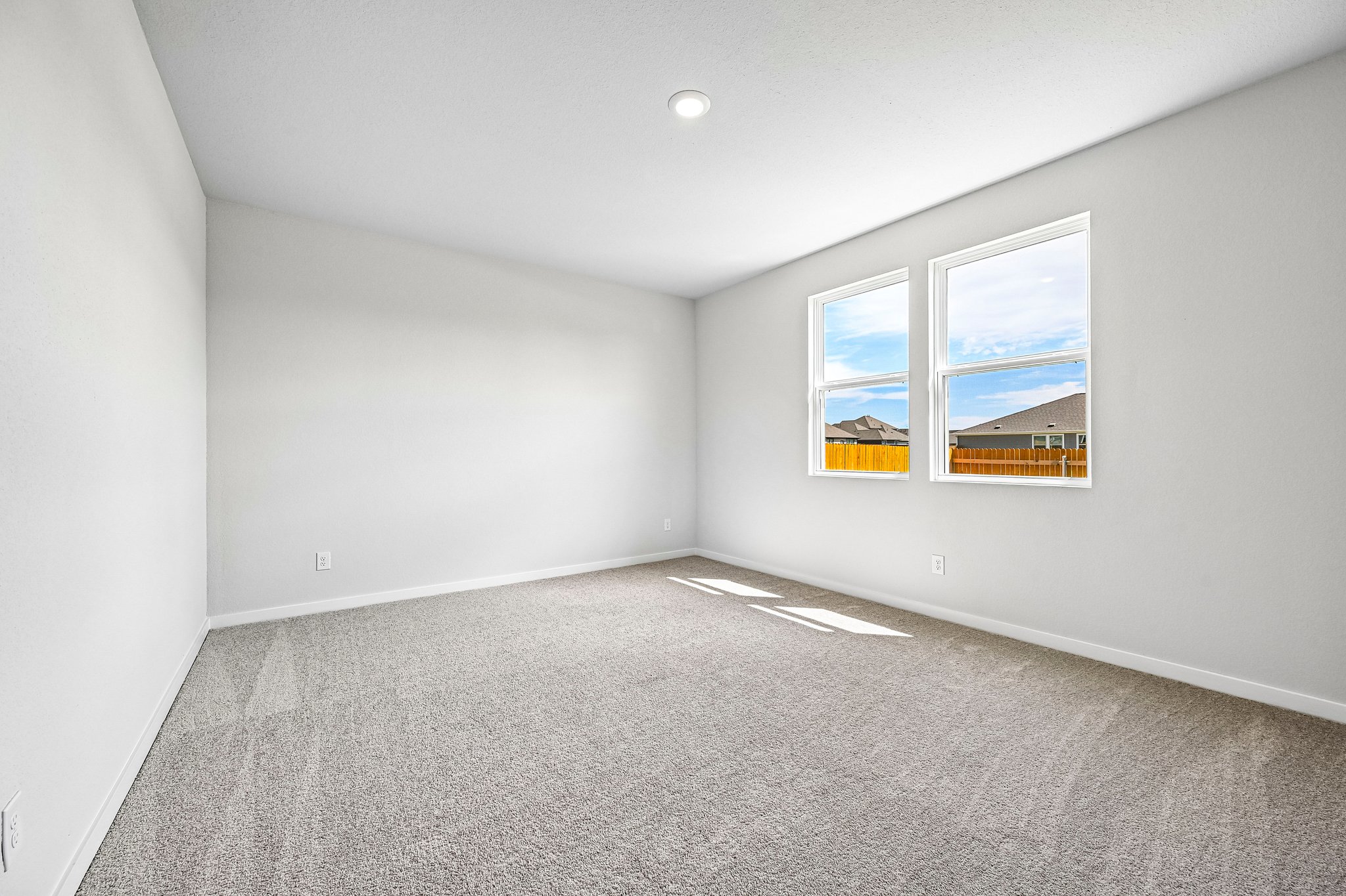 A room with a painting on the wall.
