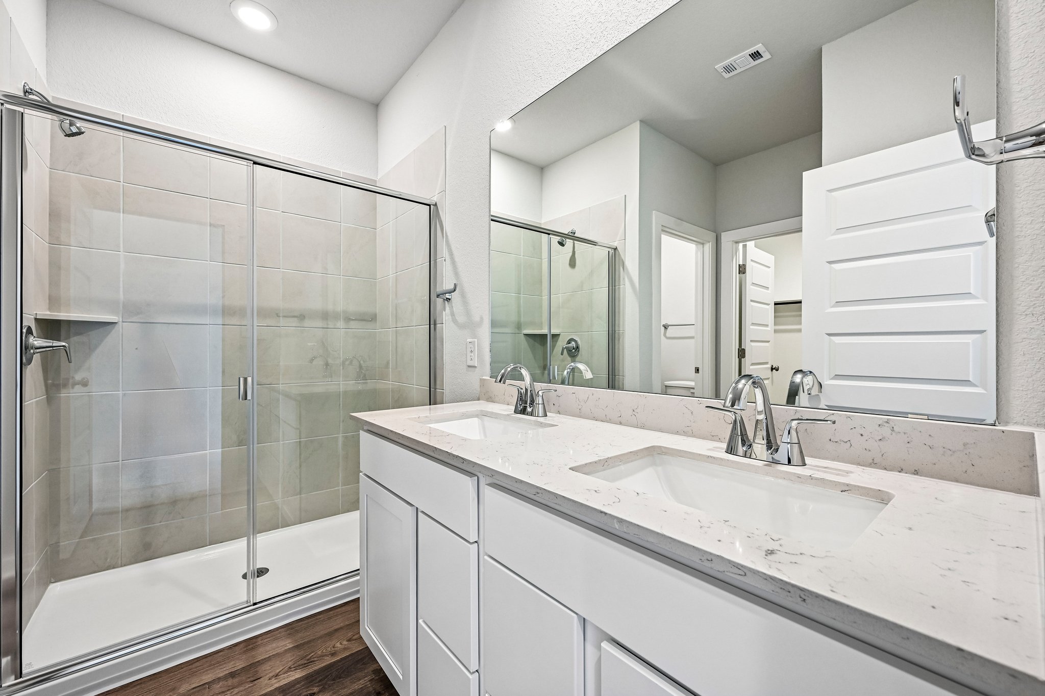 A bathroom with a glass shower.