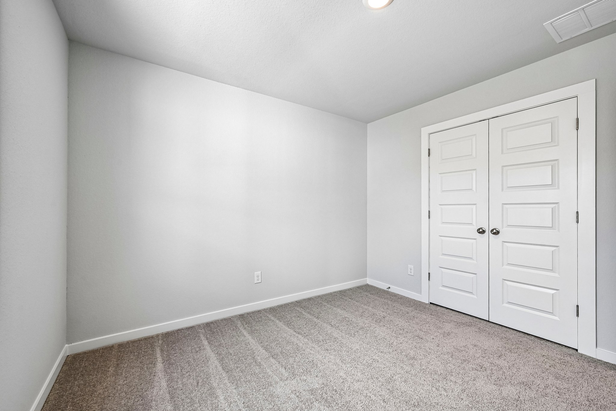 A room with white doors.