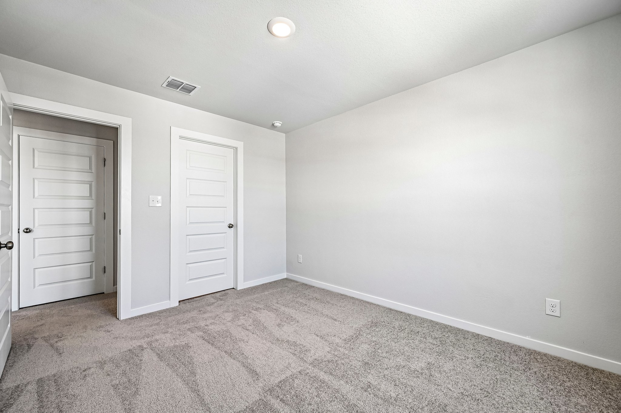 A room with white doors.