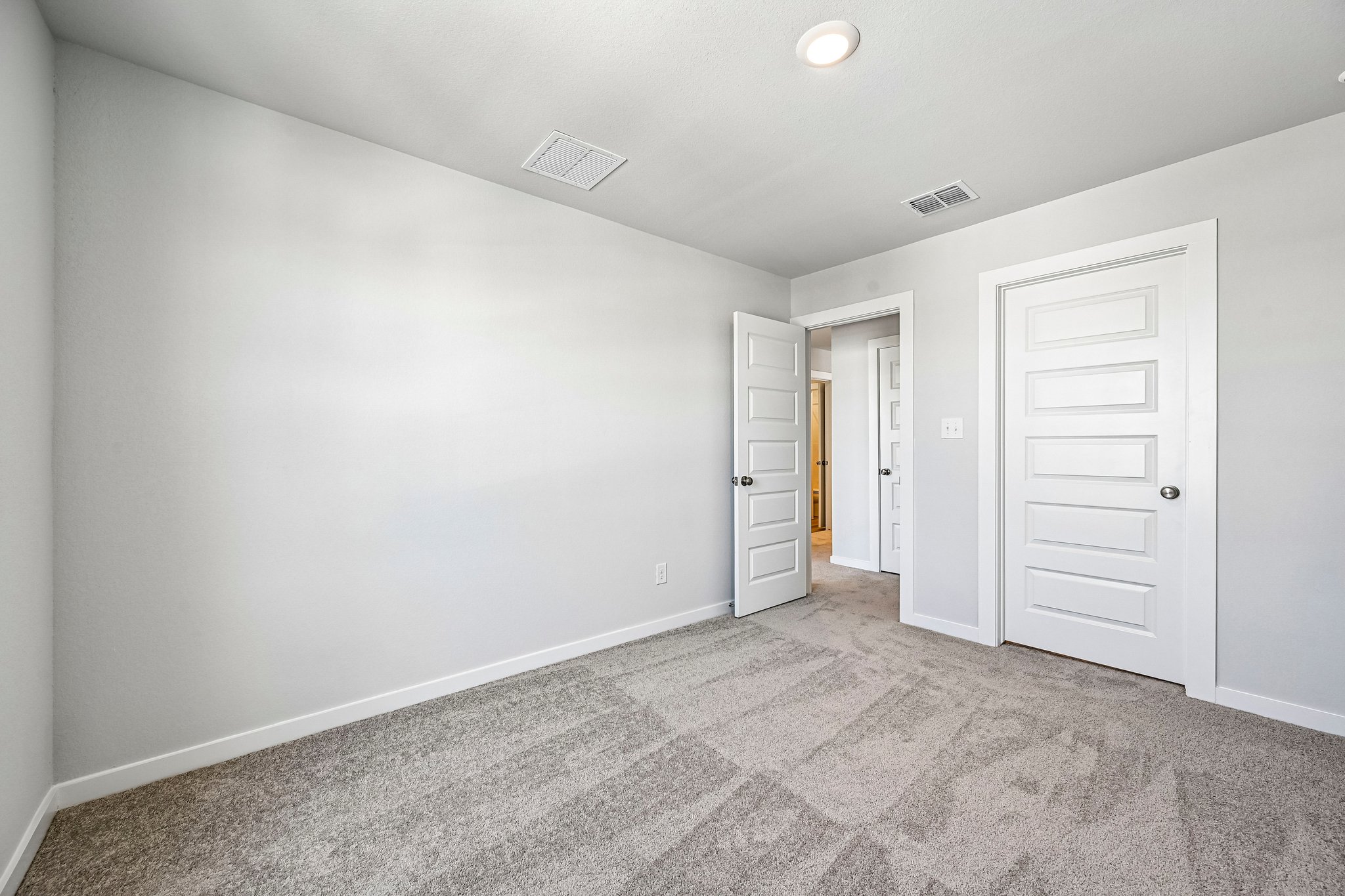 A room with white doors.