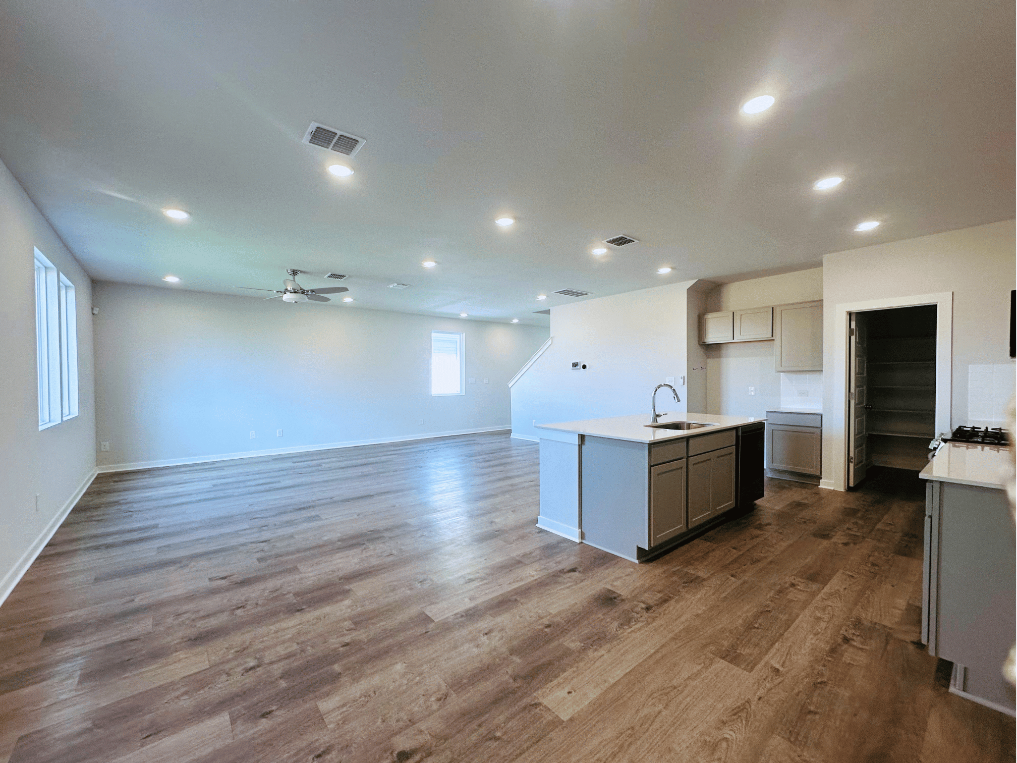 A kitchen with wooden floors.