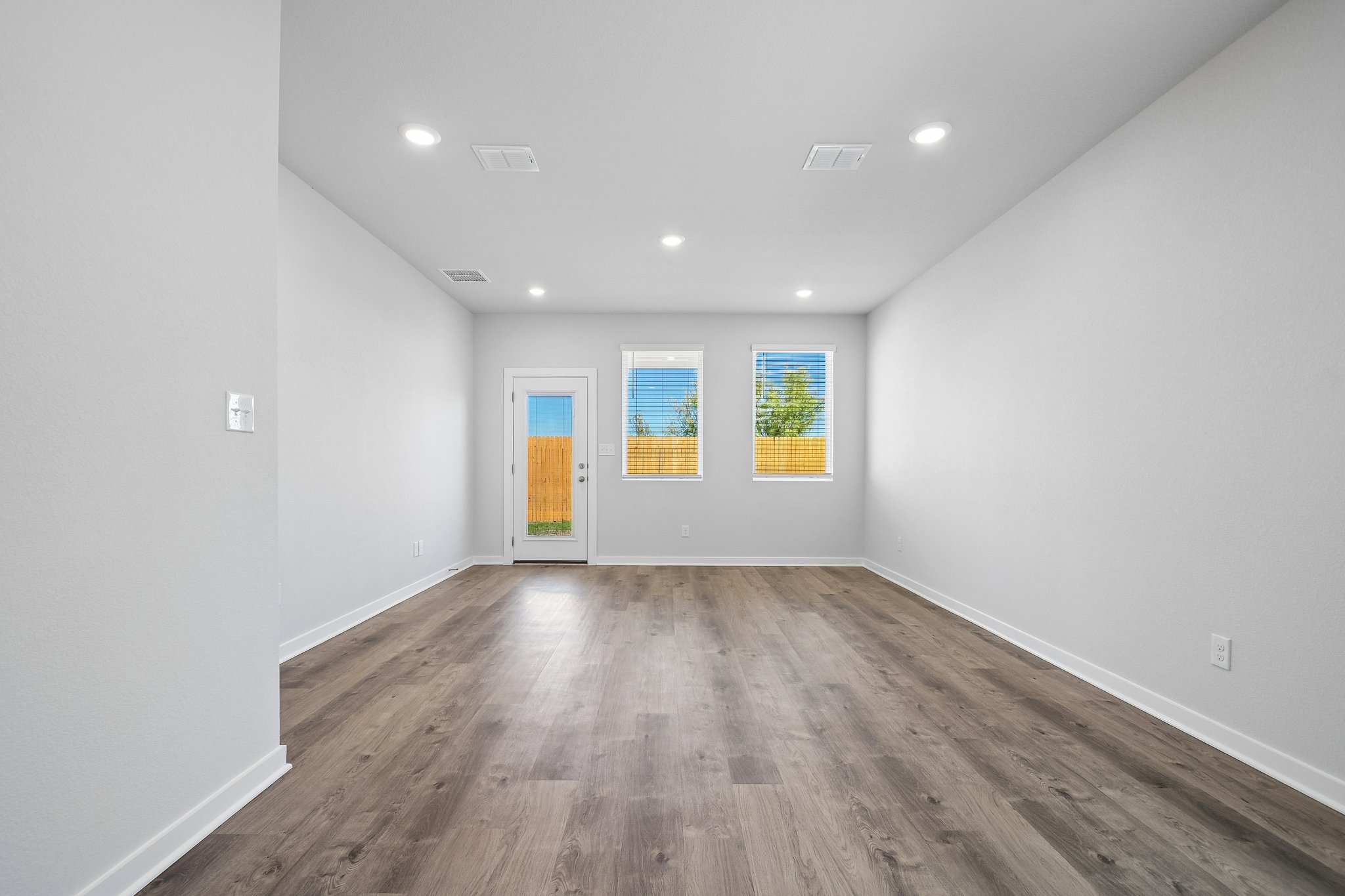 A room with a wood floor and a wood floor.