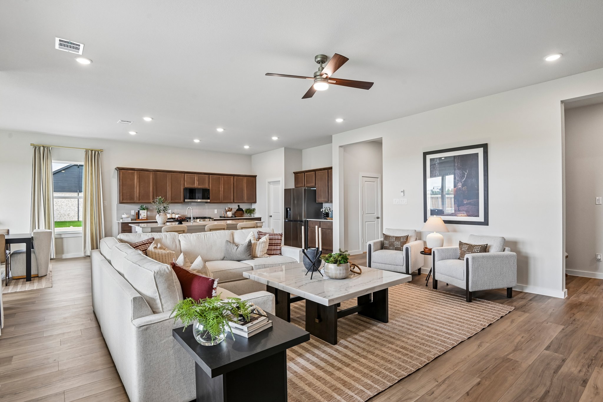A living room with a wood floor.