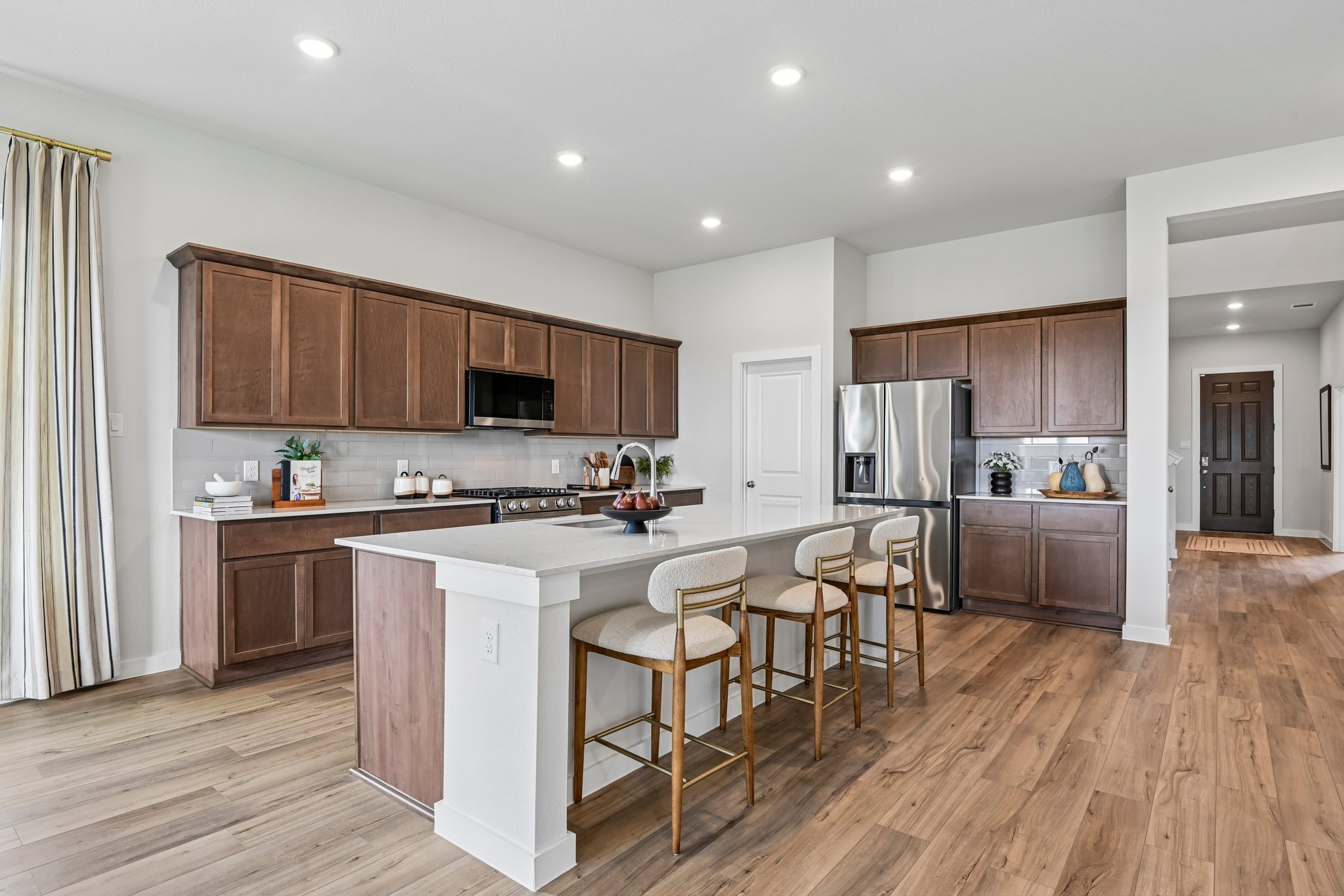 A kitchen with wooden cabinets.